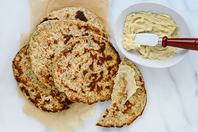 Yogurt in a dough makes for tender, chewy flatbreads; here, Raisin-Poppy Seed Flatbreads with Cardamom-Honey Butter. 