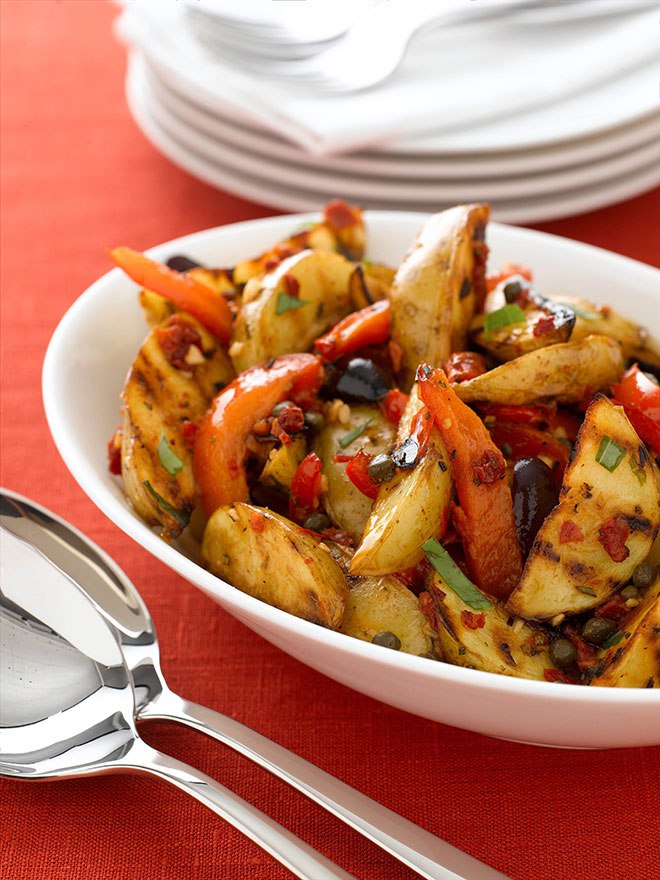 Crisp golden potatoes absorb the sweet flavour of white balsamic vinegar in this slightly Mediterranean version of a summer favourite. It can be served warm or cold.