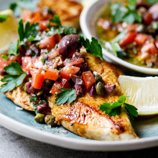 Chicken breasts with olive, tomato and caper dressing