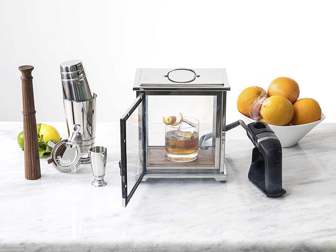 A smoking gun and glass box combo designed by bartender Charles Joly.
