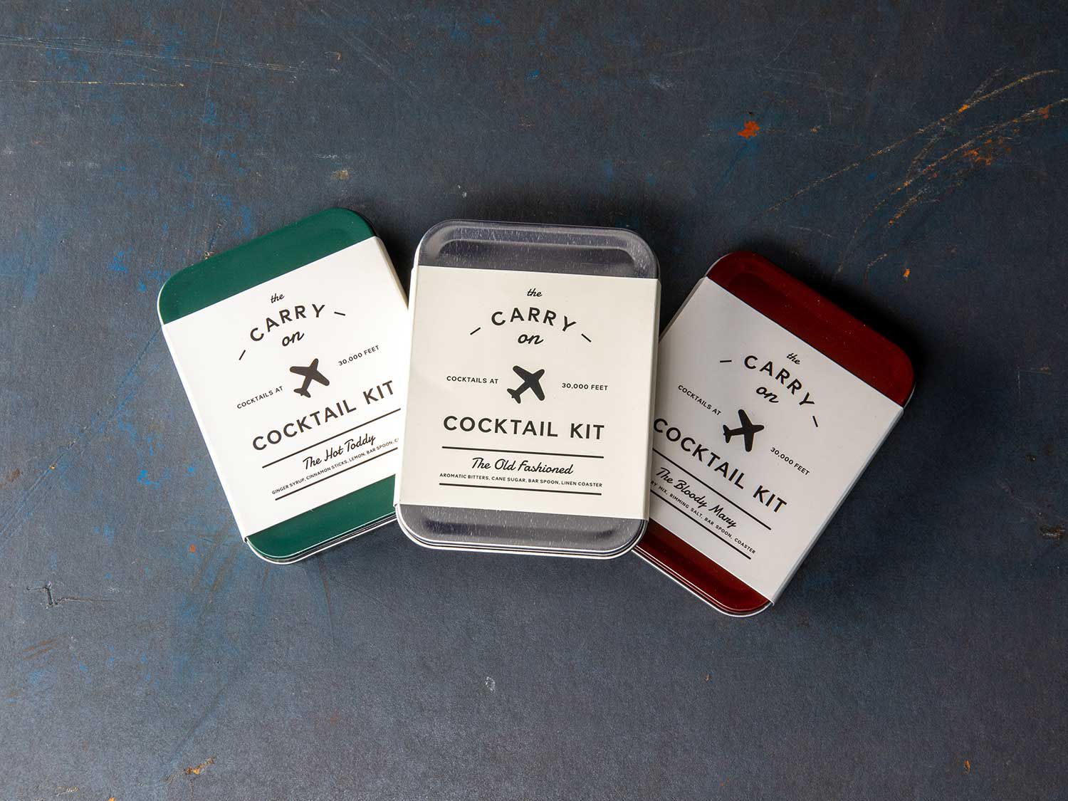Each of these tins contains everything you need to mix a drink—including a linen coaster to serve it on.