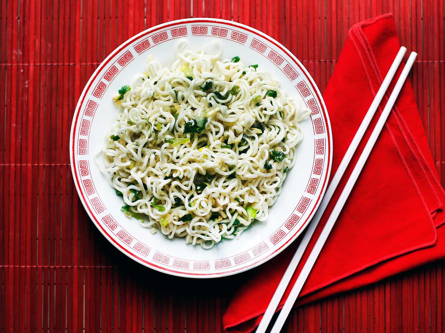 In Japan, China, and many other Asian countries, tradition calls for eating long noodles, which signify longevity, on New Year's Day. This ginger scallion sauce from NYC restaurant Momofuku is the perfect bright and spicy condiment for a bowl of lucky noodles. <a href="https://www.saveur.com/article/Recipes/Ginger-Scallion-Noodles/">Get the recipe for Momofuku Ginger Scallion Noodles</a>