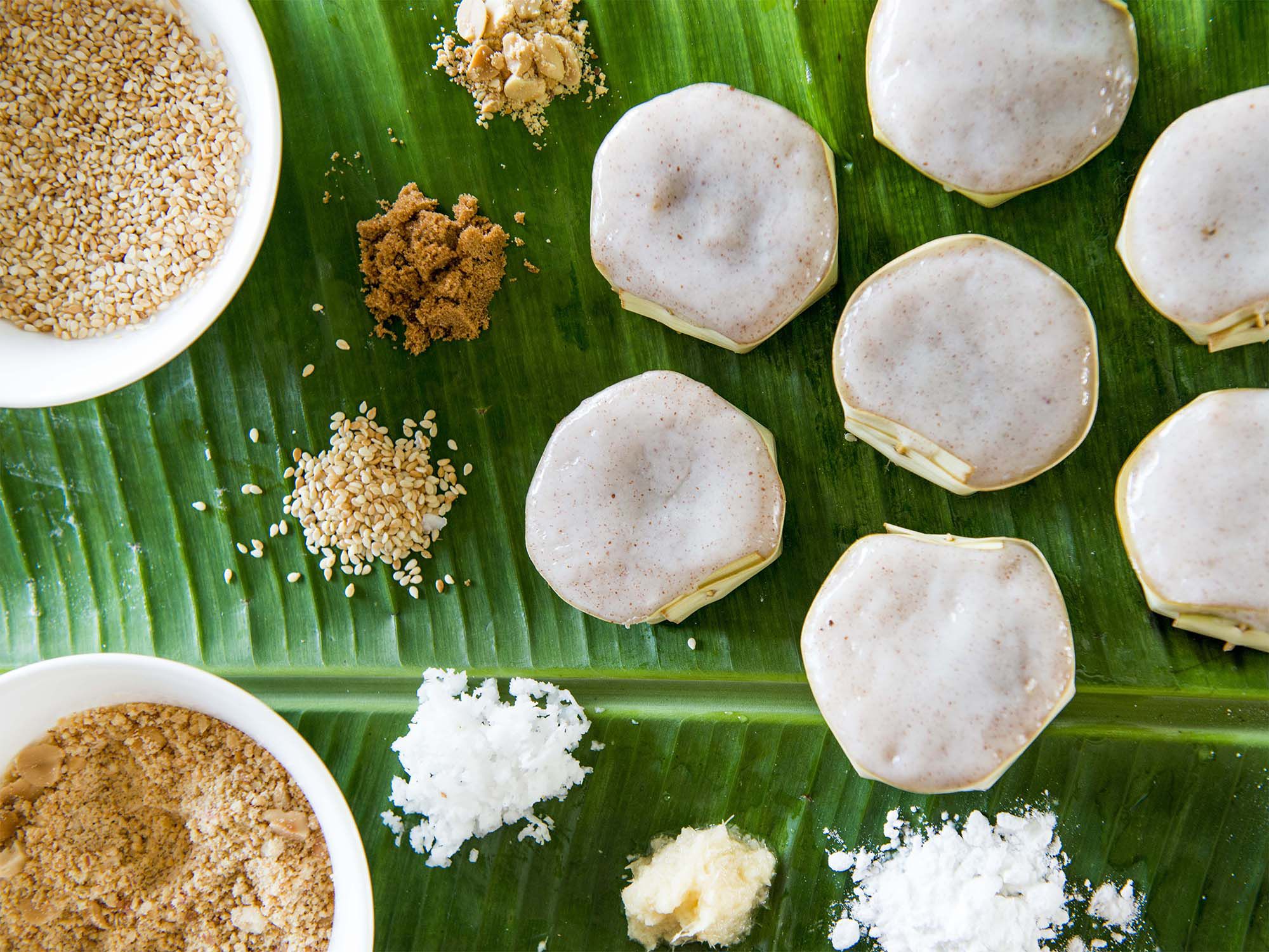 Like a tropical version of mochi, these chewy rice cakes, often eaten on sweltering Hainan days with a tall glass of coffee, hold a brown sugar and coconut filling. <a href="https://www.saveur.com/chinese-coconut-brown-sugar-rice-cakes-yi-bua-recipe/">Get the recipe for Rice Cakes Stuffed with Coconut and Brown Sugar (Yi Bua)</a>