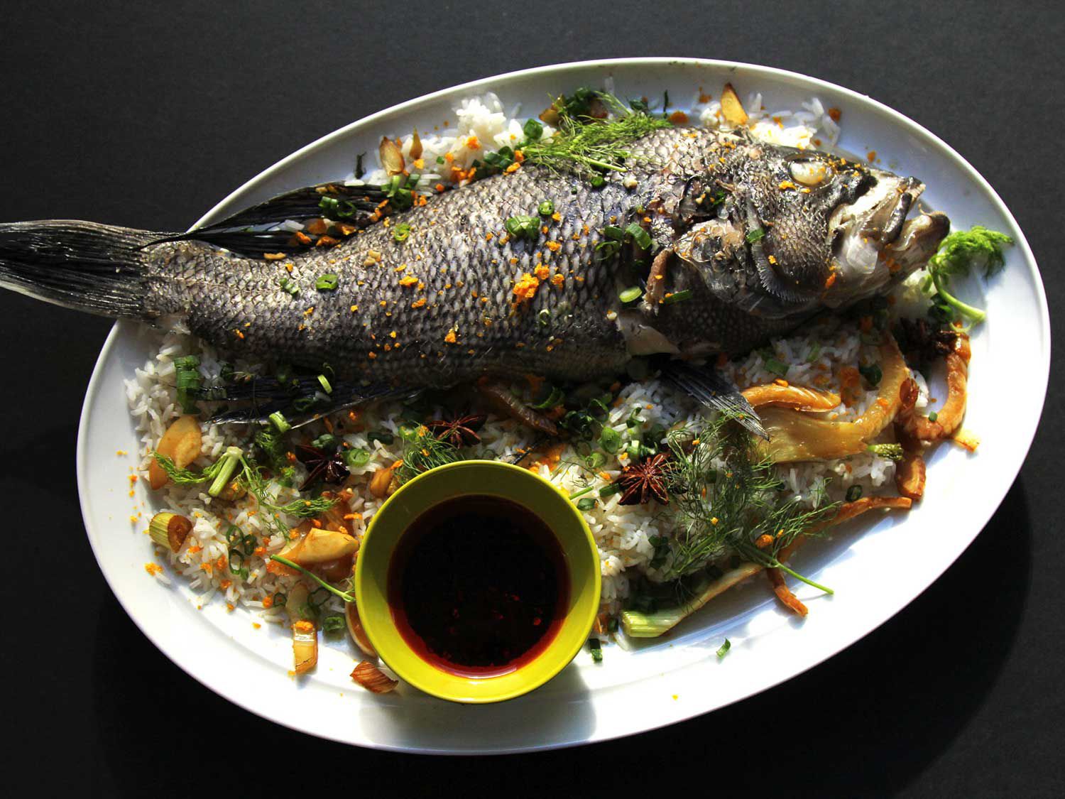 At Nom Wah Tu restaurant in New York City, chef Jonathan Wu removes all of the bones from whole fish before steaming and serving it family style. Bones or not, remember to transport the fish carefully once cooked, since the meat will be very delicate and flaky. “It’s also important to leave leftovers for the next day,” Wu says, “because this signifies that prosperity will overflow [into the new year].” <a href="https://www.saveur.com/steamed-whole-fish-dried-tangerine-peel-fennel-recipe/">Get the recipe for Steamed Whole Fish with Dried Tangerine Peel and Fennel</a>