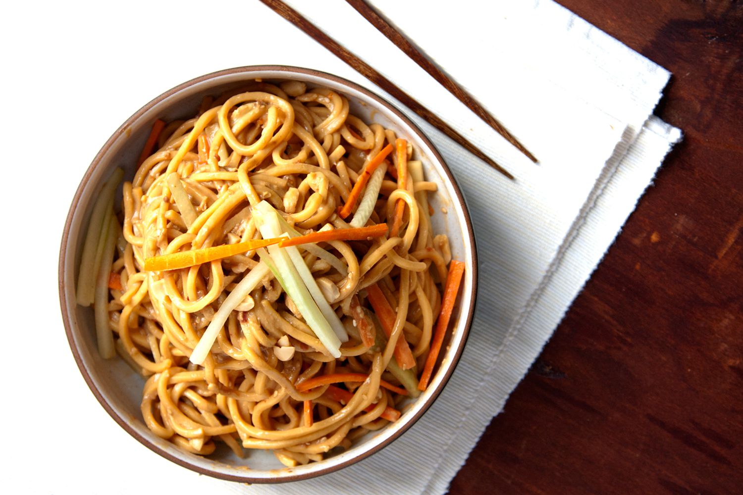Peanut butter, sesame paste, and chile-garlic paste combine to make a silky, savory sauce for these noodles—a Chinese-American restaurant staple. Chopped peanuts and a flurry of slivered cucumber and carrot add crunch. <a href="https://www.saveur.com/article/Recipes/Classic-Sesame-Noodles">Get the recipe for Cold Sesame Noodles</a>