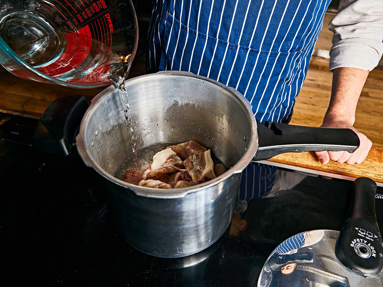 A pressure cooker makes quick work of simmering tough cuts like salted pigs’ tails.