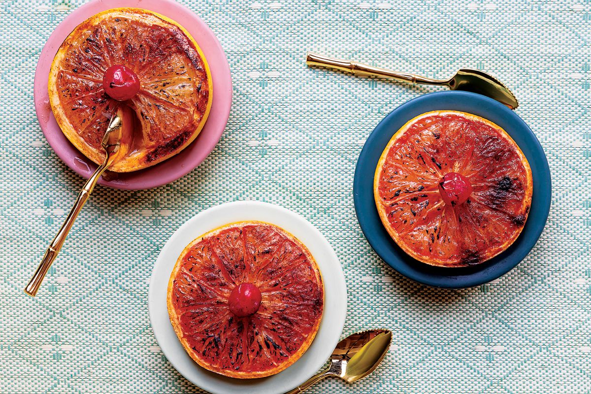 Rich dark rum is brushed over grapefruit halves, which are then sprinkled with sugar and cayenne pepper before broiling. <a href="https://www.saveur.com/article/recipes/rum-broiled-grapefruit">Get the recipe for Rum-Broiled Grapefruit</a>