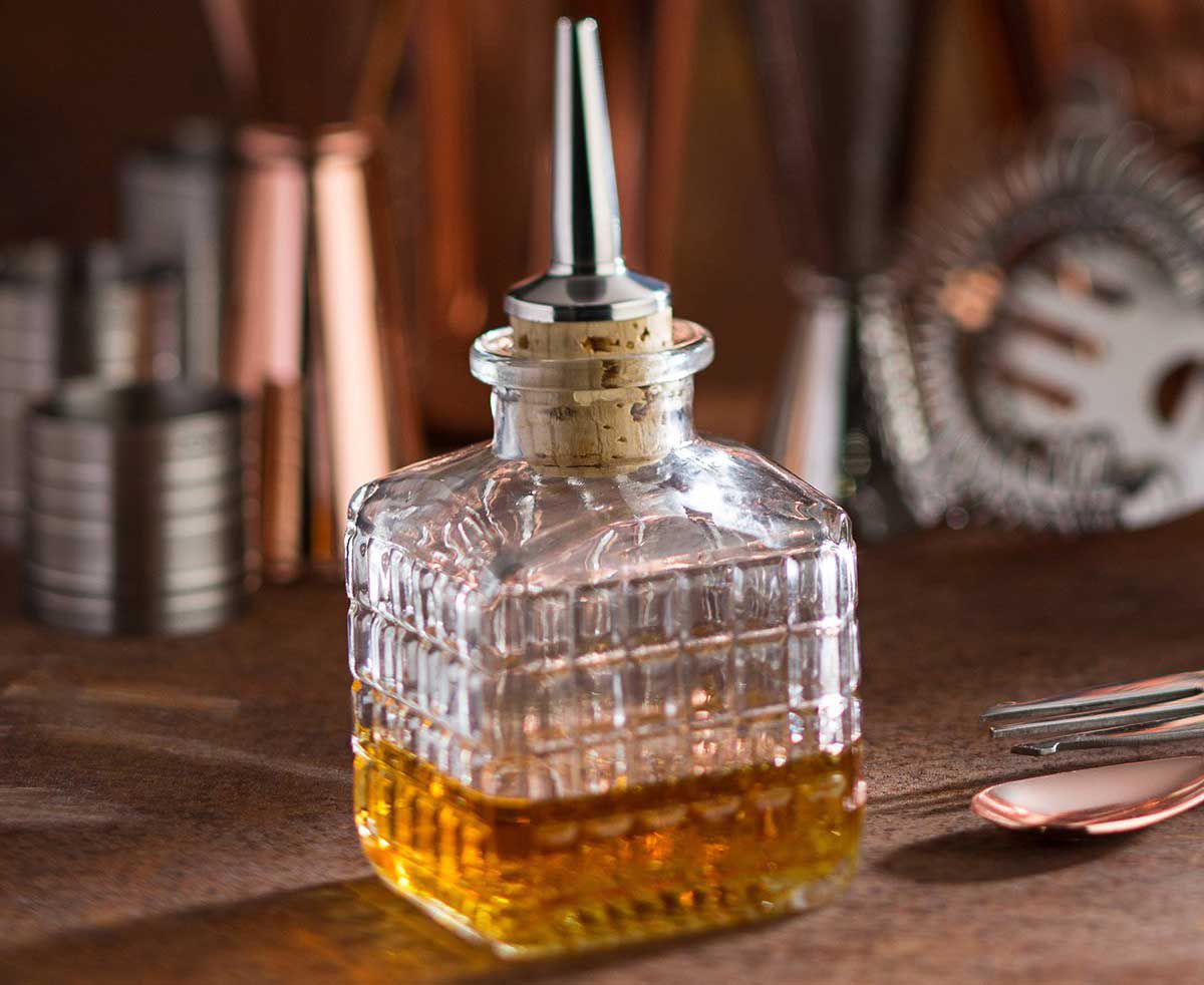 A cork-topped dasher bottle inspired by the old pharmacies of Paris.