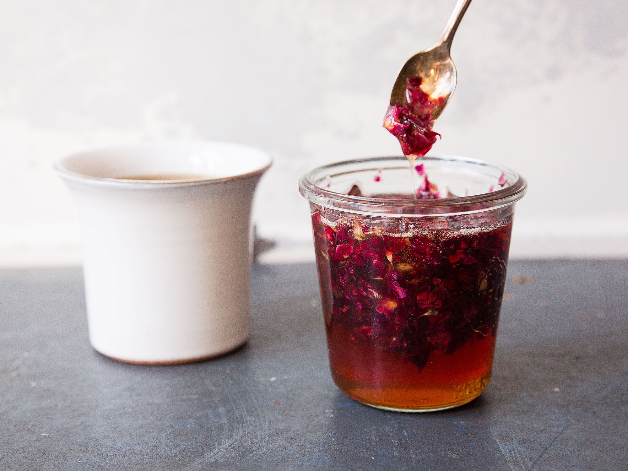 This idea comes from Christine Buckley, an herbalist and food stylist in NYC. She suggests breaking the petals into very small pieces so you don't have to decant the honey. The flecks or rose petals add texture and color and make it extra pretty. Use this any way you would use regular honey: in tea, on buttered toast, drizzled over fresh fruit or yogurt, or on anything else you'd like to add a floral sweetness to. <a href="https://www.saveur.com/rose-honey-recipe">Get the recipe for Rose Honey</a>