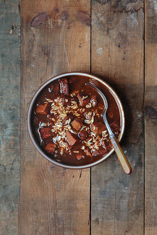 Located in a Lafayette, Louisiana farmhouse from the 1830s that has served as both a Confederate Army headquarters and, during the city's 1980s oil boom, a singles bar, Café Vermilionville smokes the turkey for this luxurious gumbo right out back in a makeshift smoker. The resulting dish embodies the rich flavors of dark roux and barbecued meat. <a href="https://www.saveur.com/article/recipes/smoked-turkey-and-andouille-gumbo/">Get the recipe for Smoked Turkey and Andouille Gumbo</a>