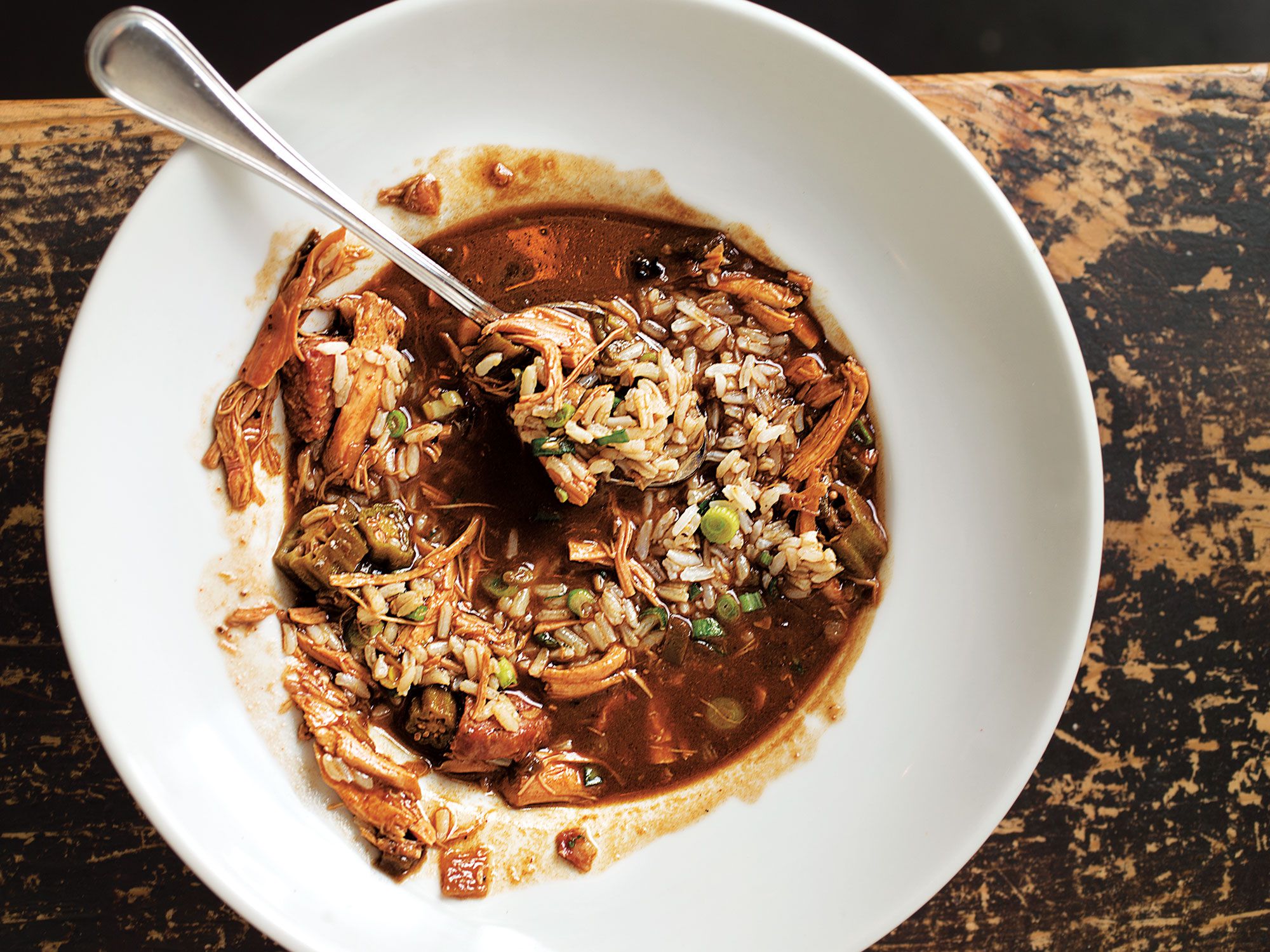 New Orleans chef Donald Link was born and raised in the Cajun town of Lake Charles, Louisiana, and this rustic gumbo, which is often served at his St. Charles Avenue restaurant Herbsaint, always reminds him of home. To give the gumbo added flavor, Link makes his roux with the same oil he uses to fry the chicken, which he later shreds and adds to the pot, along with his homemade andouille sausage. The result is a dark, thick, rustic stew with just the right amount of heat. <a href="https://www.saveur.com/article/recipes/fried-chicken-and-andouille-gumbo/">Get the recipe for Fried Chicken and Andouille Gumbo</a>