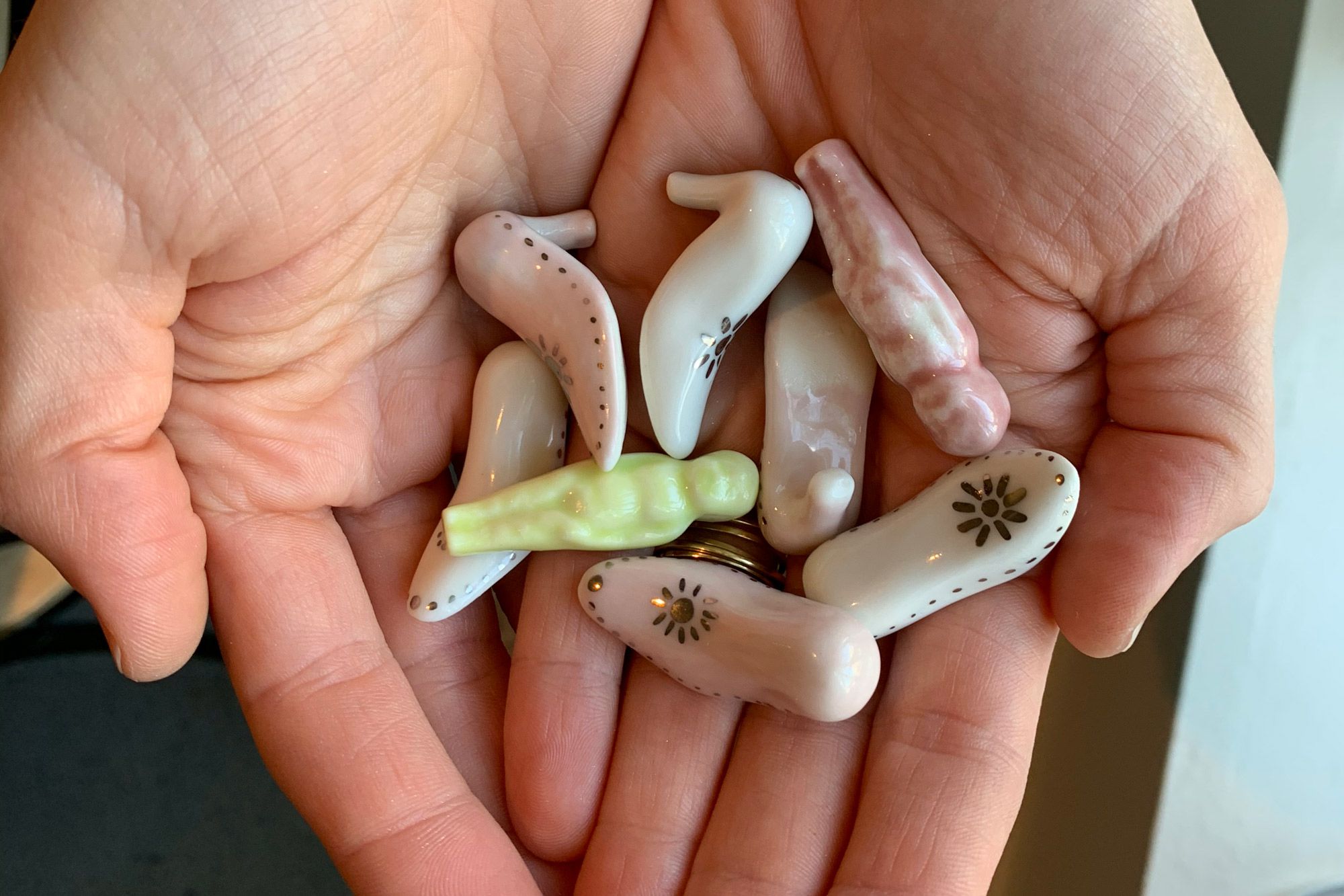 New Orleans artist Jackie Brown has been hand-crafting porcelain fèves for Levee’s Queen Cakes since their inception three years ago. The shapes—baby, shoe, fish, moon—change often and are inspired by old styles of classic king cake trinkets.