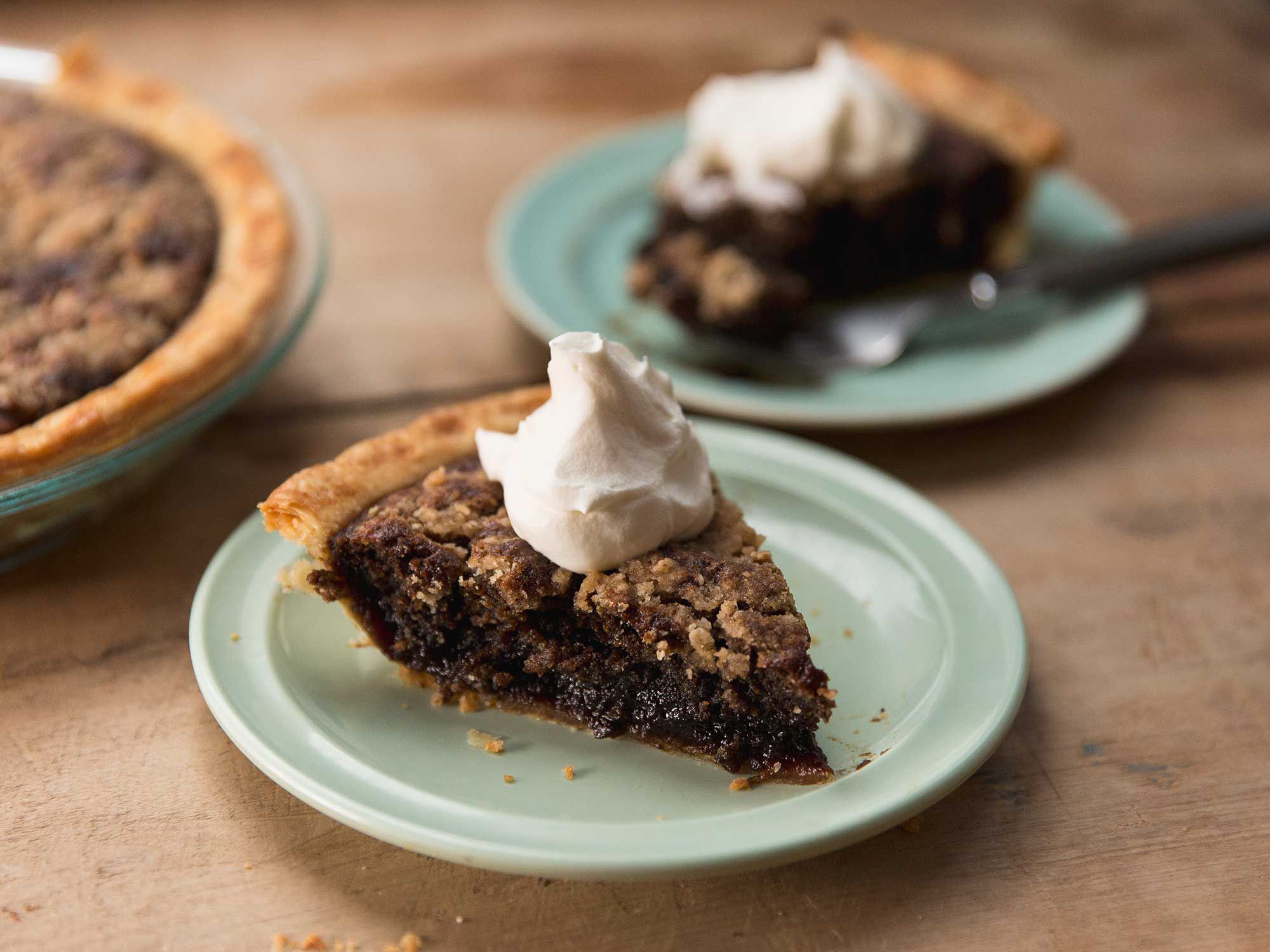 We love this Shoofly pie—a molasses-filled, crumb-topped concoction from Pennsylvania Dutch country—was supposedly given its name because its shiny, sweet, and aromatic filling attracted flies that needed to be politely asked to leave. The pie, which is sprinkled with buttery crumbs that sink into the molasses and give it a cakelike consistency when baked, is classically served one of two ways: "wet bottom" (cakelike up top and still fudgy below) or "dry bottom" (cakelike throughout). Get the recipe for <a href="https://www.saveur.com/shoofly-pie-recipe">Shoofly Pie</a>