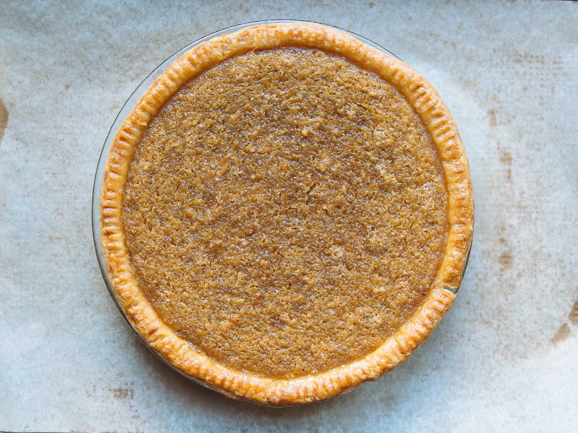 The original recipe for this pie, adapted from Princess Pamela's Soul Food Cookbook, was a mere few lines—devoid of even a dough recipe and intended for laid-back, confident bakers. Using fresh grated coconut is essential: It creates the ideal texture and keeps the sugary filling from skewing too sweet. Use the fine side of a box grater, or place small pieces of fresh coconut in a food processor. Get the recipe for <a href="https://www.saveur.com/brown-coconut-pie-recipe">Brown Coconut Pie</a>
