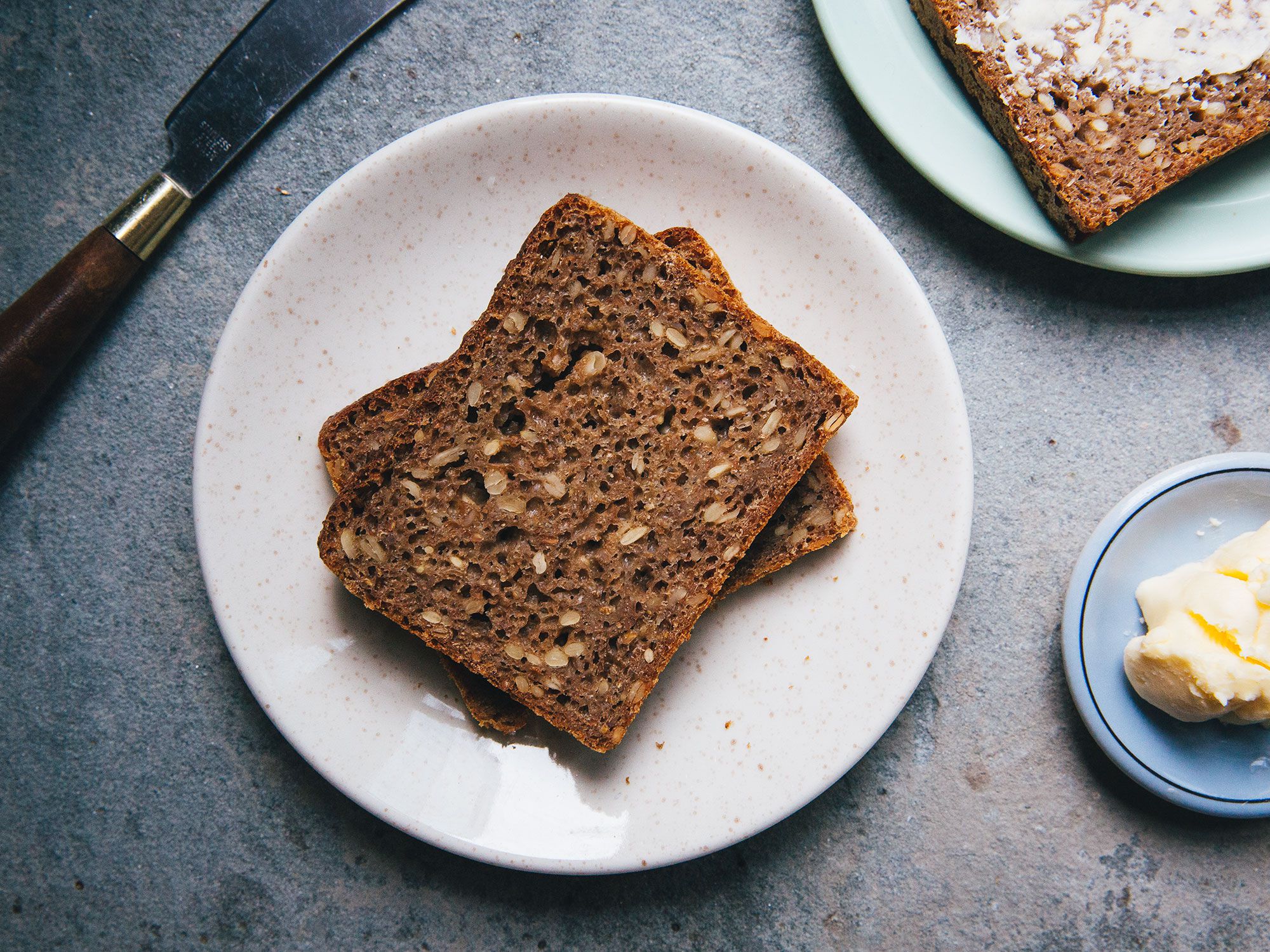 Danish-style rye bread is the most traditional base for smørrebrød. Usually fermented, it's malty and sweet with a sour tang. In other words, even a thin slice has robust flavors. However, some modern restaurants choose to show off more delicate toppings (like seafood), on slices of toasted white bread or brioche. Get the recipe for <a href="https://www.saveur.com/danish-rye-bread">Danish-style Rye Bread</a>