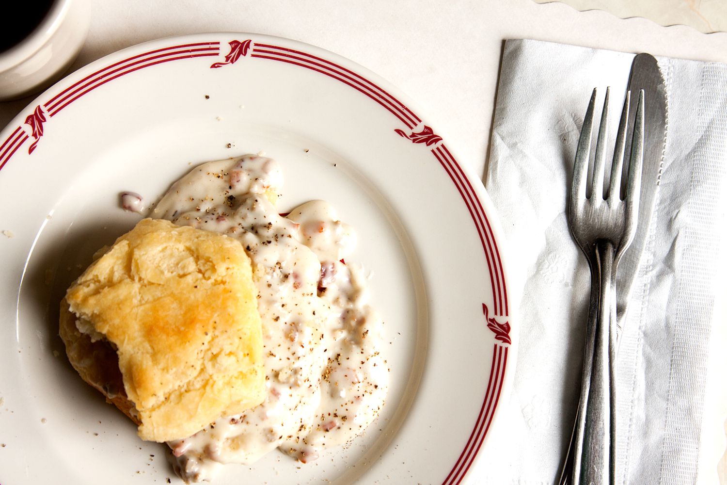 One of the pillars of the Southern breakfast table, buttery biscuits smothered in a sausage-studded white gravy makes a hearty meal any time of day. A hint of cayenne brightens the gravy's richness, but it's even better with a dash or two of hot sauce. Get the recipe for <a href="https://www.saveur.com/article/Recipes/Classic-Biscuits-Gravy/">Biscuits with Sawmill Gravy</a>