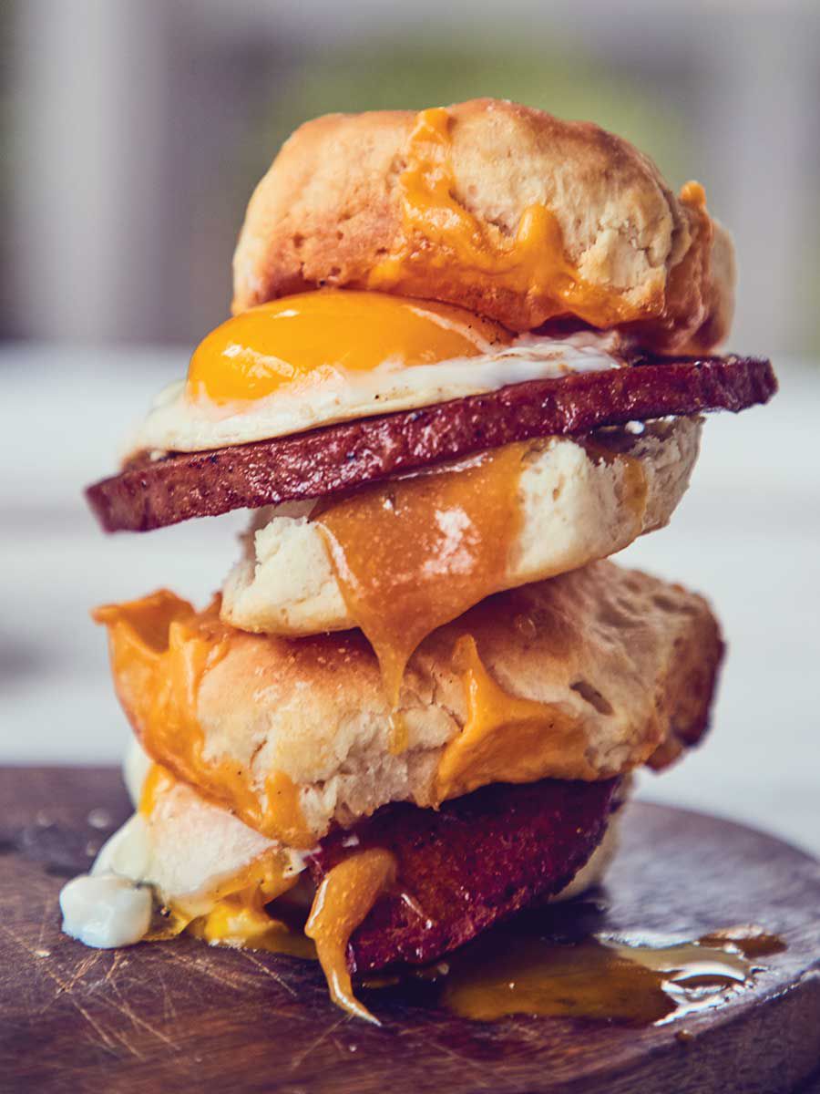Bologna makes an excellent breakfast sandwich swap for sausage or country ham, particularly when it's purchased from a good butcher, browned in a pan, and layered on warm, split biscuits. Runny fried eggs, melted American cheese, and sweet, sharp mustard make a good thing even better. Get the recipe for <a href="https://www.saveur.com/bologna-egg-cheese-biscuit-recipe/">Seared Bologna, Egg, and Cheese Biscuit Sandwiches with Sweet Mustard</a>