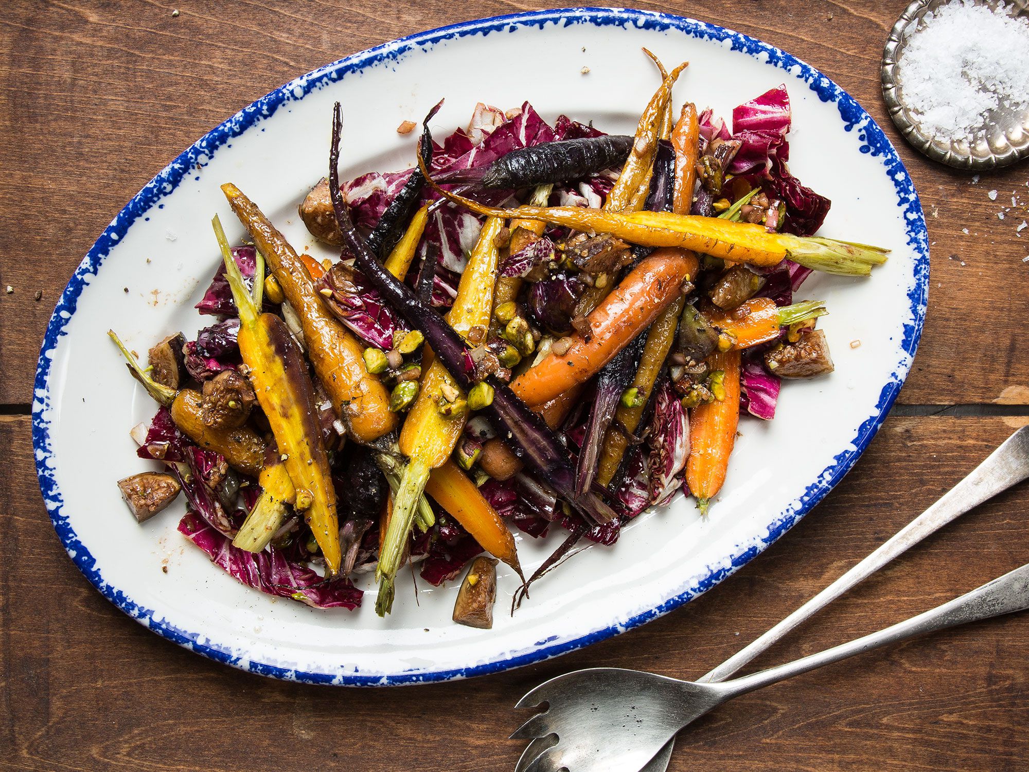 Carrots are roasted before being topped with crunchy pistachios and a sweet fig vinaigrette in a simple salad from Eli and Max Sussman's <em>Classic Recipes for Modern People</em> (Olive Press, 2015). Get the recipe for <a href="https://www.saveur.com/article/recipes/carrot-and-pistachio-salad/">Carrot and Pistachio Salad</a>
