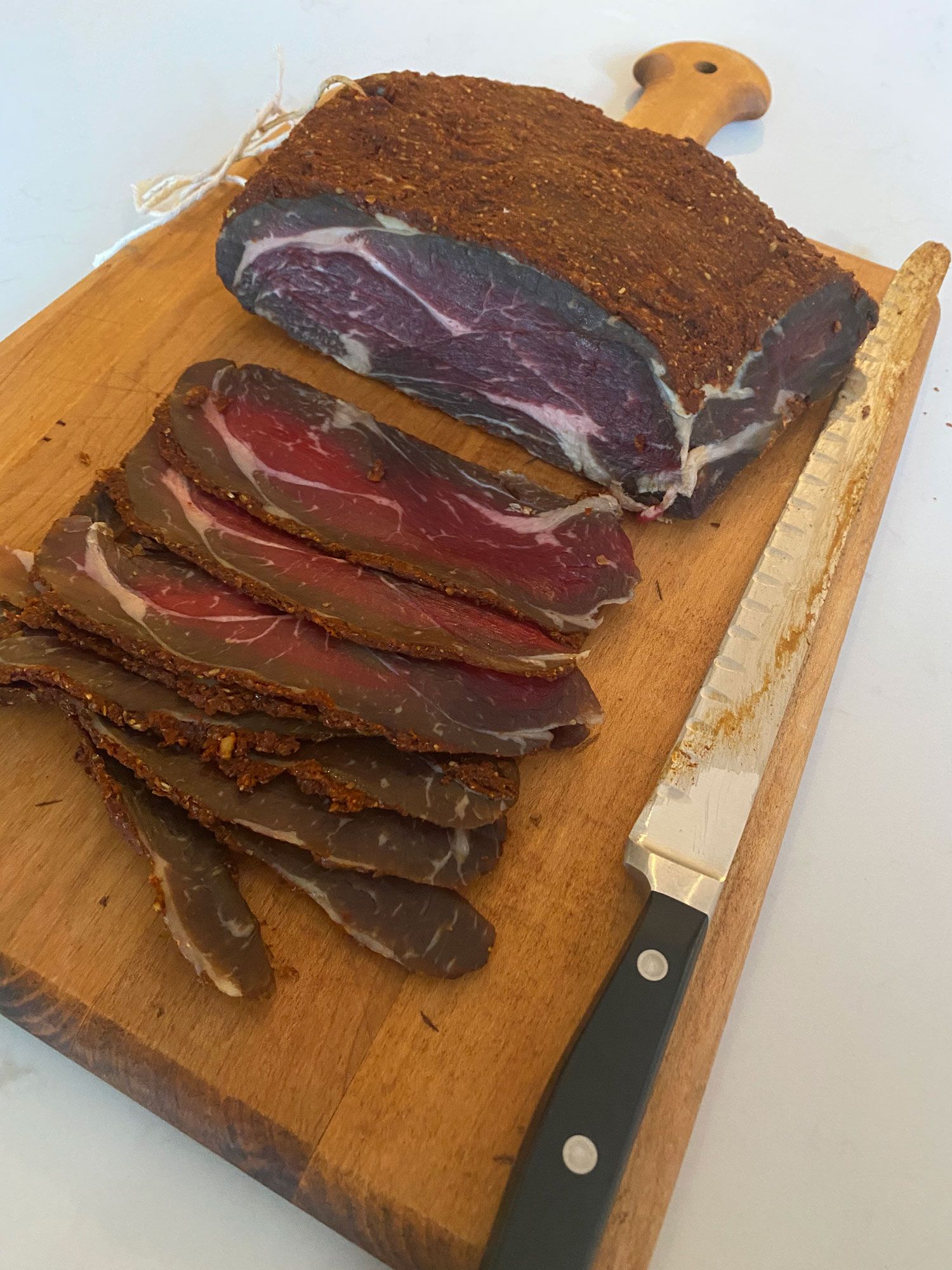 Don’t be alarmed if the meat darkens at the edges. Unlike most charcuterie products, which are made with nitrates, basturma will oxidize and change color slightly as it makes contact with the air.