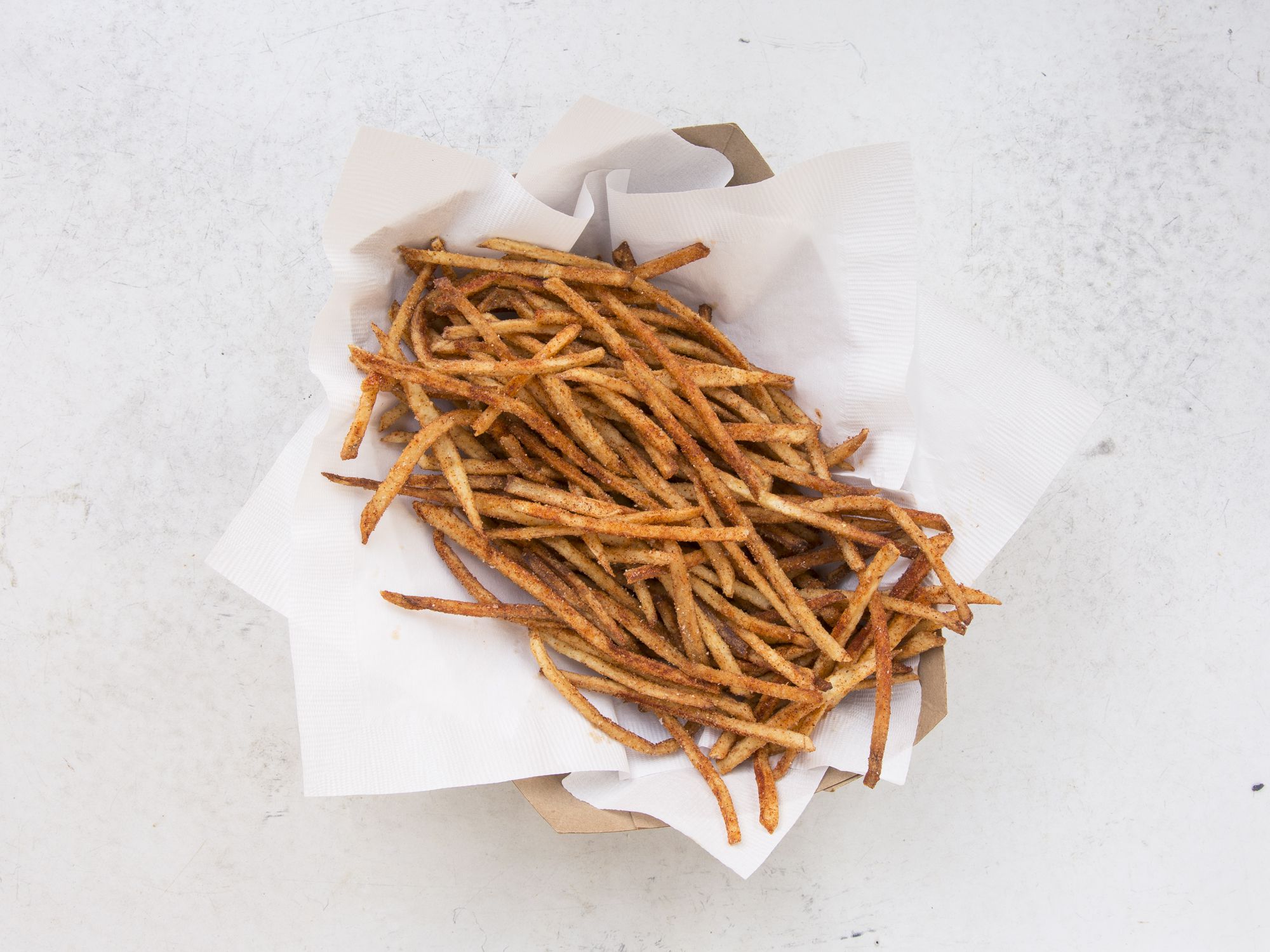 These spicy, crunchy fries are our take on the classic packaged snack. Get the recipe for <a href="https://www.saveur.com/hot-fries-recipe">Hot Fries</a>