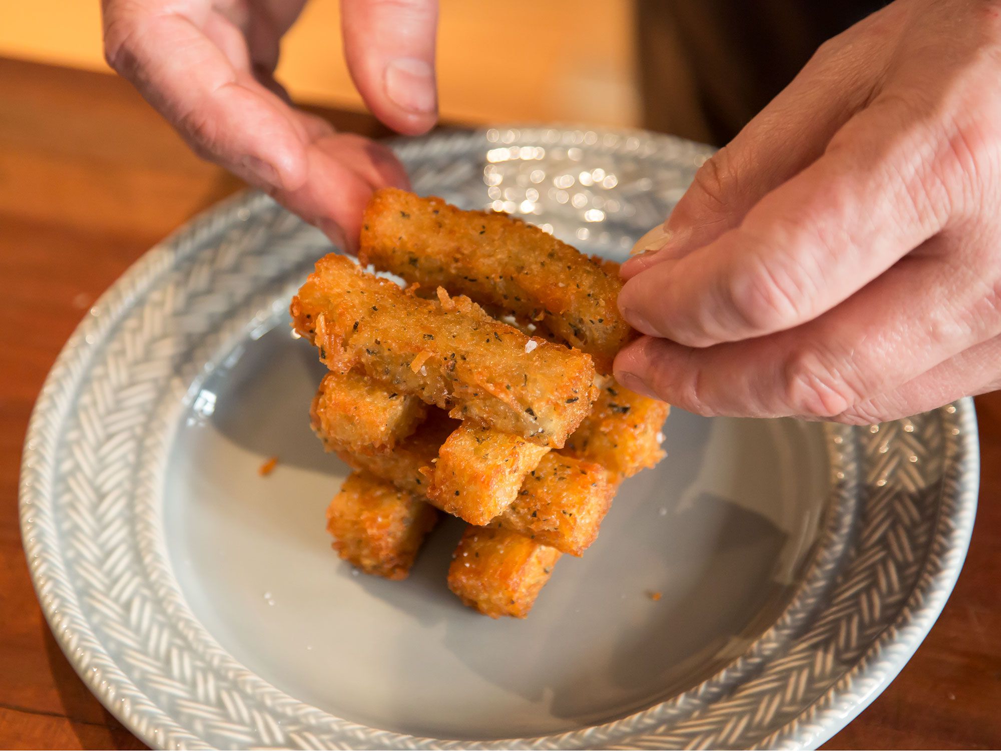 Using a traditional French confit method in which the potatoes are slow-cooked in duck fat, chef David Kinch, of Michelin-starred Manresa restaurant in Los Gatos, CA, makes a particularly luxurious tot. Get the recipe for <a href="https://www.saveur.com/david-kinchs-tater-tots">David Kinch's Tater Tots</a>