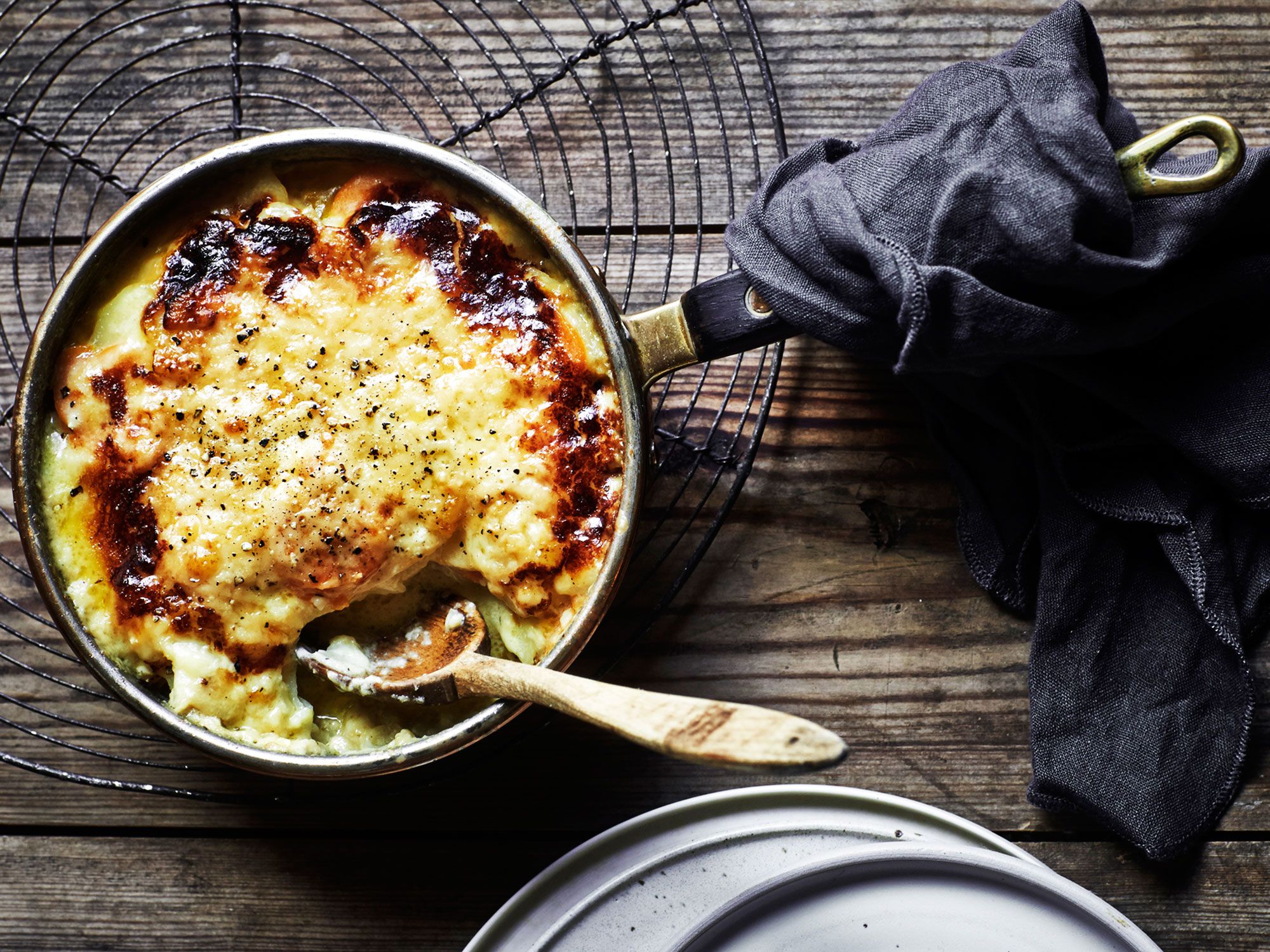 This simple, comforting root vegetable gratin is perfumed with fragrant thyme and bay leaves before being baked with a bubbly Gruyère crust. Get the recipe for <a href="http://www.saveur.com/celery-root-carrot-and-potato-gratin-recipe">Celery Root, Carrot, and Potato Gratin</a>