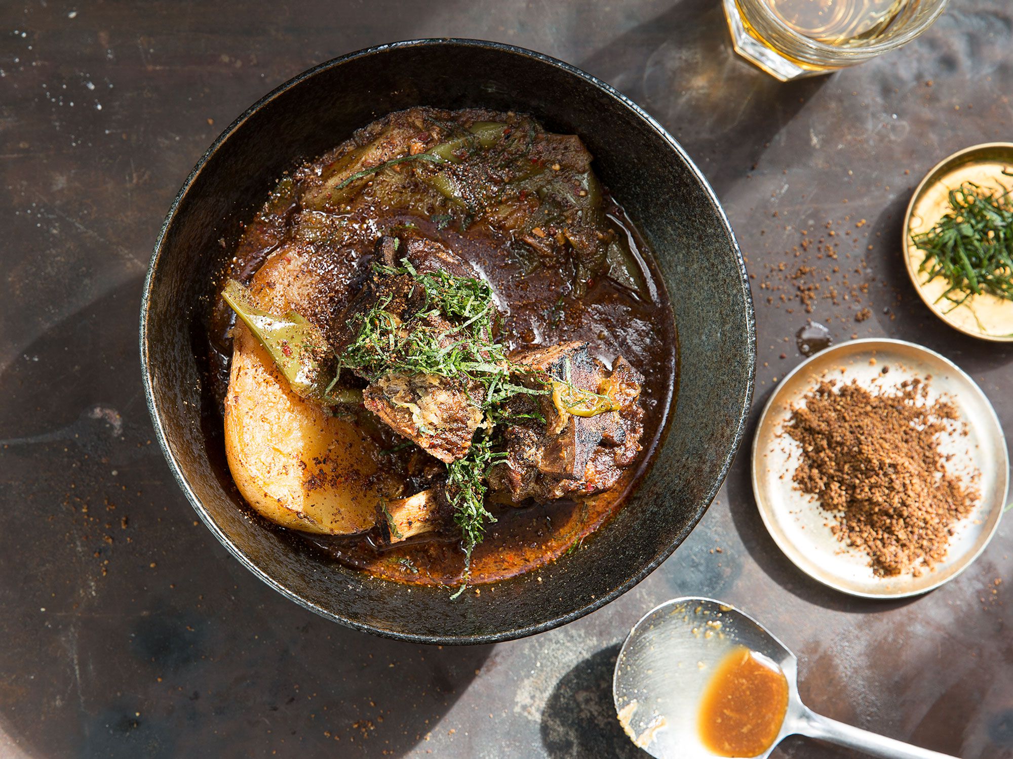 A classic hearty Korean stew made with meaty pork neck, potatoes, and nutty perilla seeds. Sesame seeds cannot be substituted for the perilla in this recipe; seek perilla seed, also called wild sesame seed, out at Asian markets. Optional but recommended: Serve this dish with its <a href="http://www.saveur.com/korean-gamjatang-dipping-sauce-recipe">accompanying dipping sauce</a>. Get the recipe for <a href="http://www.saveur.com/gamjatang-spicy-korean-pork-neck-and-potato-stew-recipe">Gamjatang (Spicy Pork Neck and Potato Stew)</a>