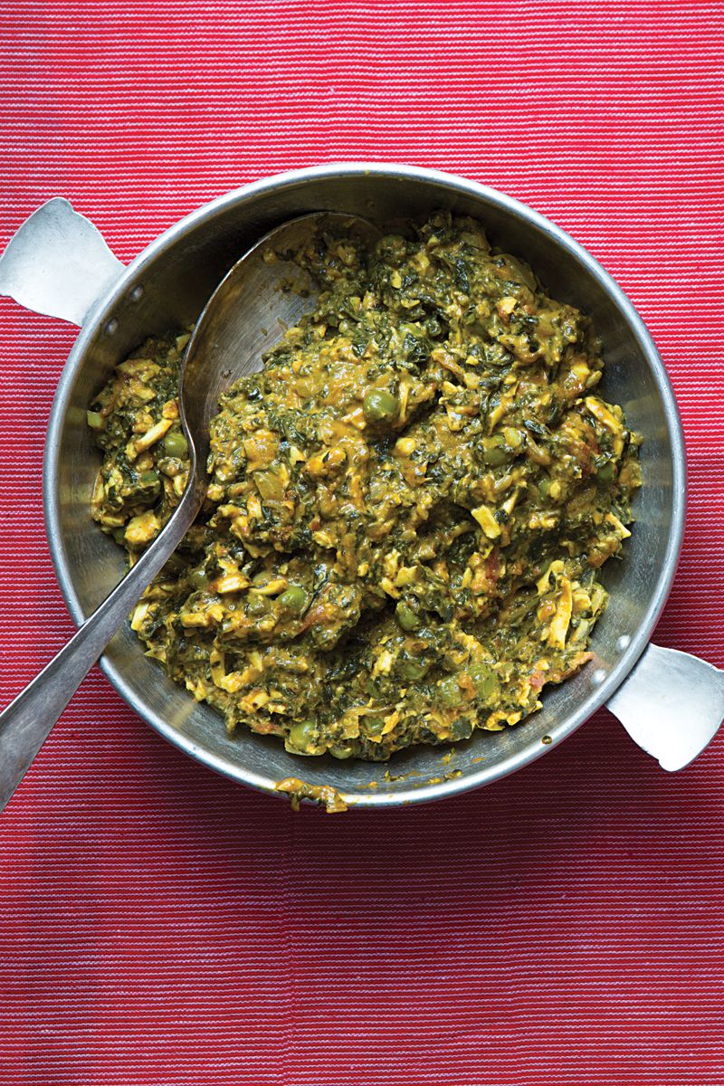 This creamy dish from Toronto-based Indian cookbook author Smita Chandra makes a phenomenal spread, with oven-baked naan bread on the side. It's made with the fresh Indian cheese called paneer, peas, and whole peeled tomatoes, along with plenty of tangy fresh fenugreek greens, and it's spiced lavishly with turmeric, coriander, garam masala, and more. If you can't find fenugreek greens, kale, Swiss chard, or another green can be substituted. Get the recipe for <a href="https://www.saveur.com/article/recipes/methi-malai-paneer-creamy-fenugreek-and-spinach-with-cheese/">Creamy Fenugreek and Spinach with Cheese (Methi Malai Paneer)</a>