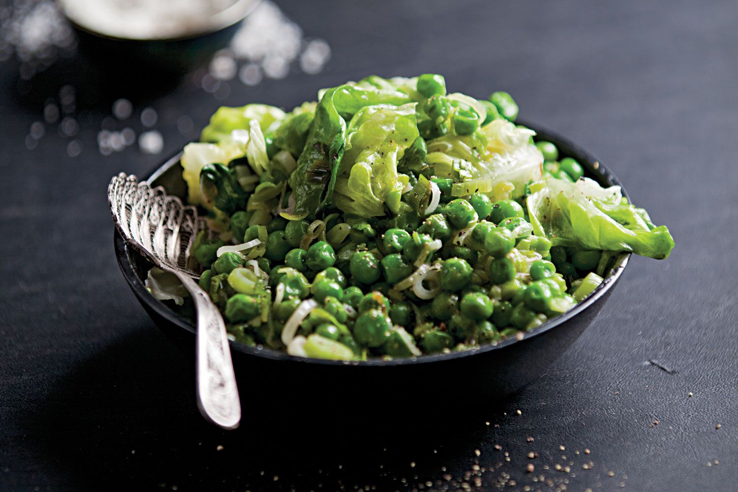 This side dish from Andrea Reusing's <em>Cooking in the Moment: A Year of Seasonal Recipes</em> (Clarkson Potter, 2011) is the essence of summer: emerald green vegetables cooked together briefly, until their flavors just meld. Get the recipe for <a href="https://www.saveur.com/article/Recipes/Fresh-Peas-With-Lettuce-and-Green-Garlic/">Fresh Peas With Lettuce and Green Garlic</a>
