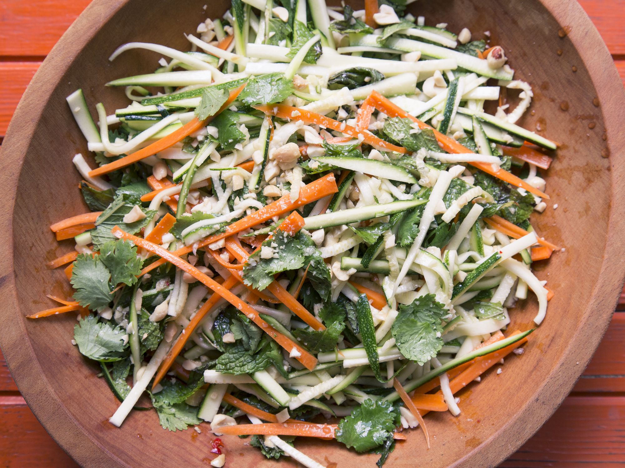 Matchstick ribbons of zucchini and carrot mingle with grassy, fresh herbs, and roasted peanuts in this salad inspired by the flavors of Thailand. A pungent, savory, tart dressing brings the dish together. Get the recipe for <a href="https://www.saveur.com/spicy-thai-style-zucchini-carrot-salad-recipe">Spicy Thai-Style Zucchini Carrot Salad</a>
