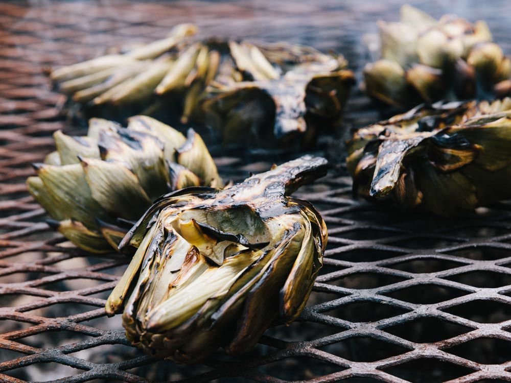 This is a recipe you should double or even triple. Trust us. Most of the preparation is done in advance, leaving just a brief sear over high heat to finish—perfect for while you're waiting for the fire to die down. Get the recipe for <a href="http://www.saveur.com/grilled-artichokes-with-espelette-mayo-recipe">Grilled Artichokes with Espelette Mayo</a>