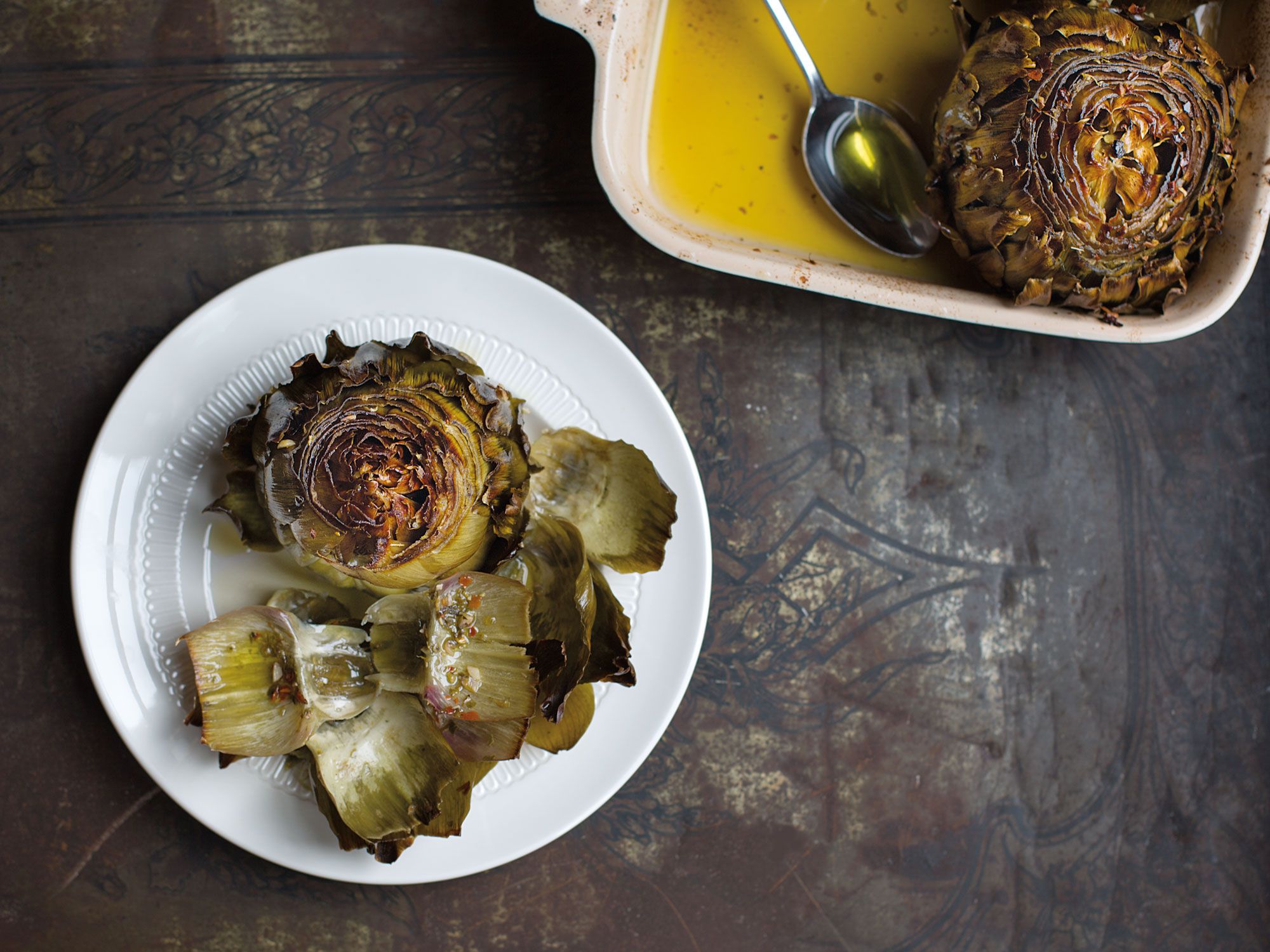 Though traditionally cooked in embers, these artichokes are equally as succulent when oven-roasted. Get the recipe for <a href="https://www.saveur.com/article/Recipes/Carciofi-Arrostiti-Roasted-Artichokes/">Roasted Artichokes (Carciofi Arrostiti)</a>