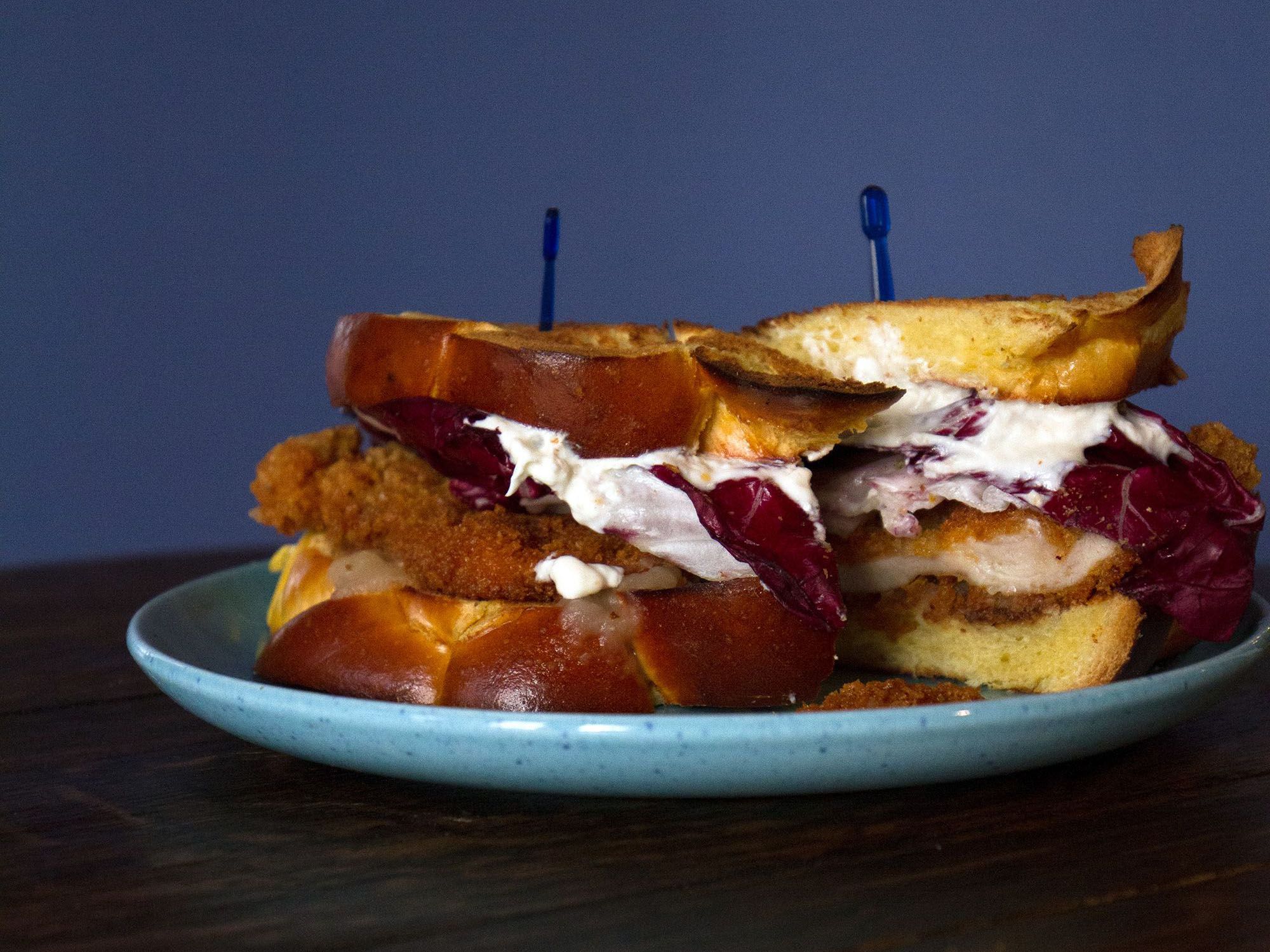 This sandwich is Mile End Deli's Eli Sussman's fun take on the fried chicken classic; the horseradish cream offsets the bitterness of the radicchio and the richness of the schnitzel nicely. Get the recipe for <a href="https://www.saveur.com/article/recipes/chicken-schnitzel-sandwich-with-horseradish-cream-and-radicchio/">Chicken Schnitzel Sandwich with Horseradish Cream and Radicchio</a>