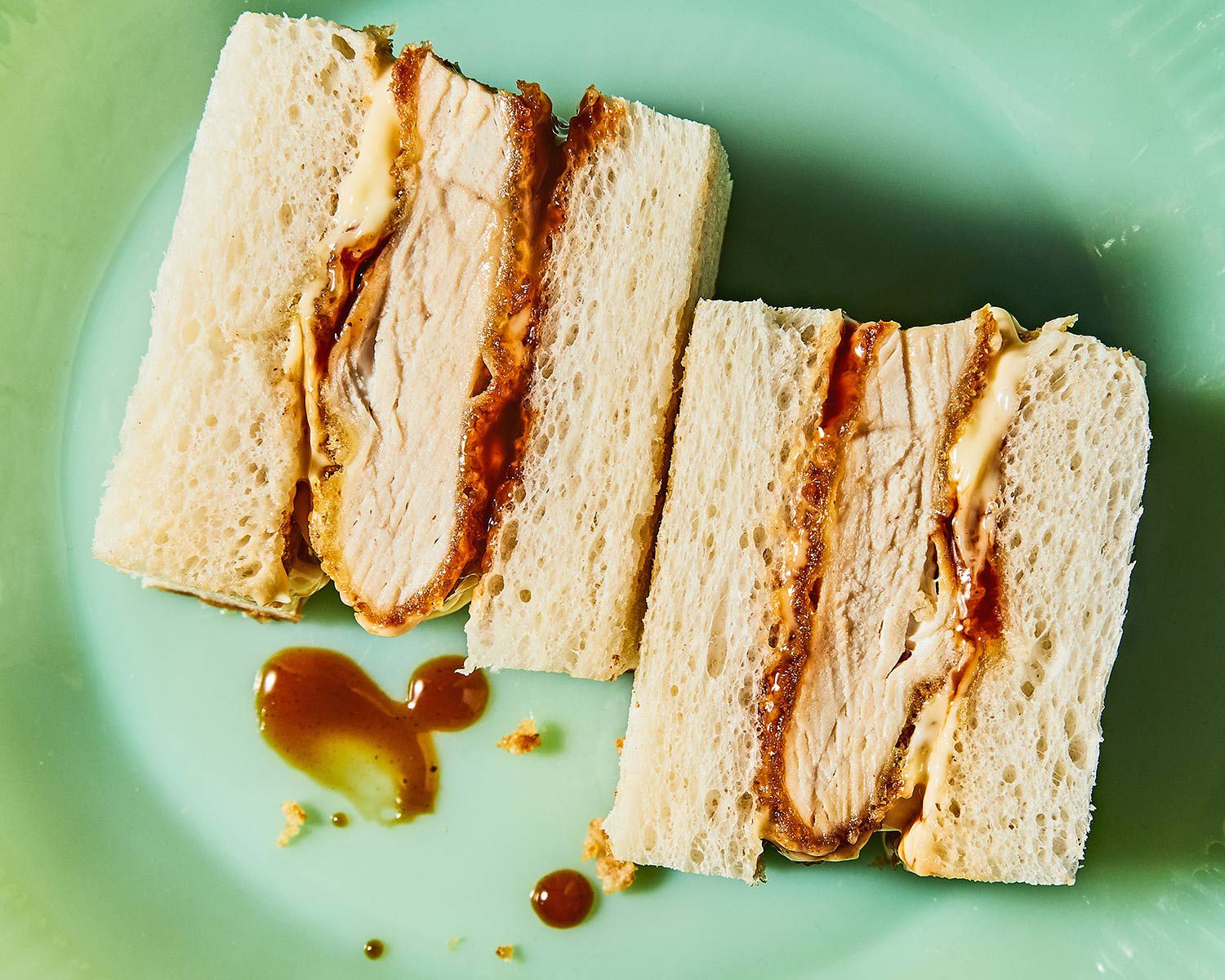 There are four key components to a classic katsu sando: a perfectly fried cutlet (in this case, chicken), Kewpie mayonnaise, Bull-Dog tonkatsu sauce, and the fluffiest Japanese milk bread. Get the recipe for <a href="https://www.saveur.com/chicken-katsu-sandwich-recipe/">Chicken Katsu Sandwich</a>