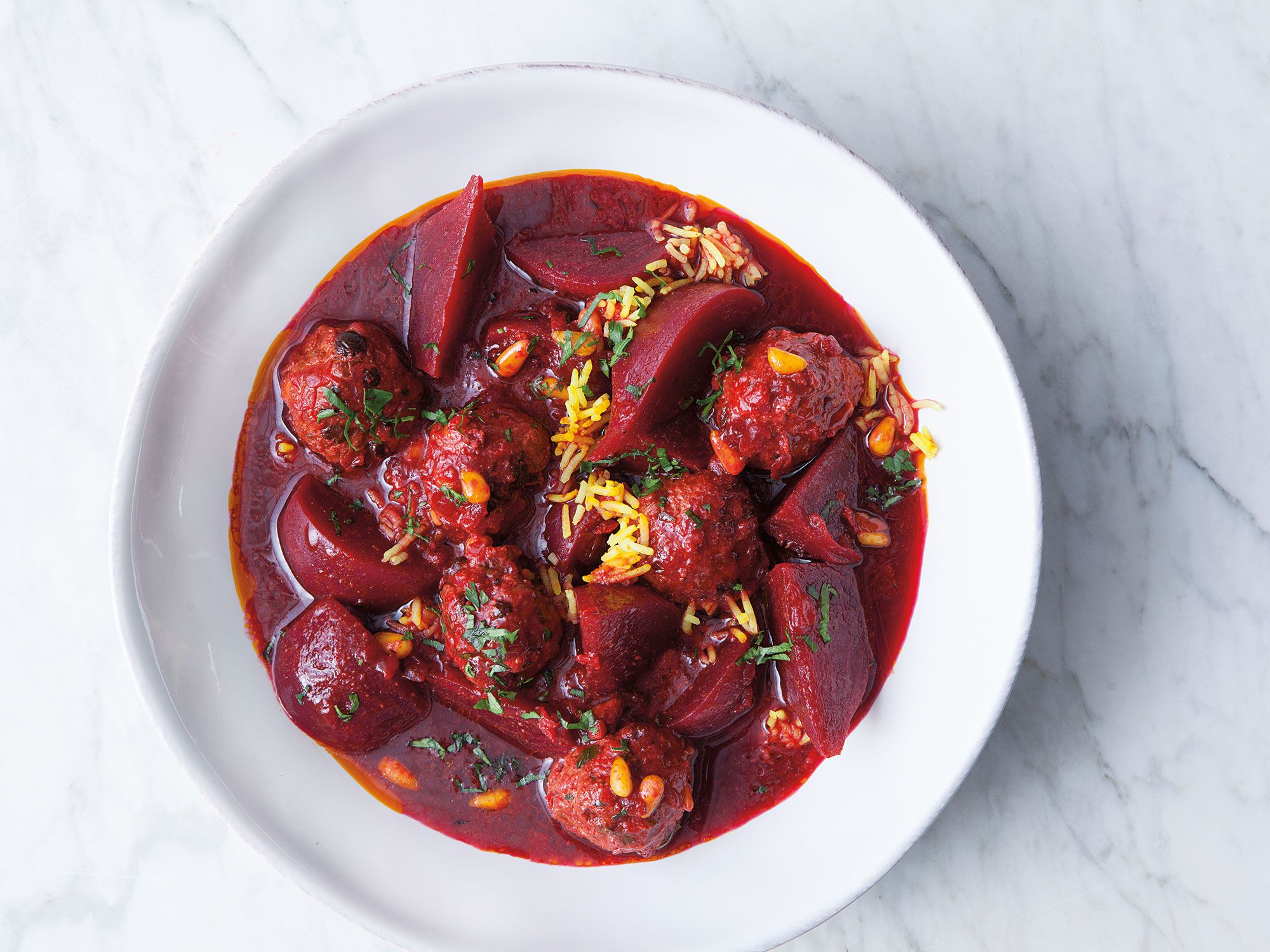 For this traditional Iraqi-Jewish dish, ground-lamb meatballs are braised in a vibrant beet stew. Get the recipe for <a href="https://www.saveur.com/article/Recipes/Beet-Stew-with-Lamb-Meatballs">Beet Stew with Lamb Meatballs</a>