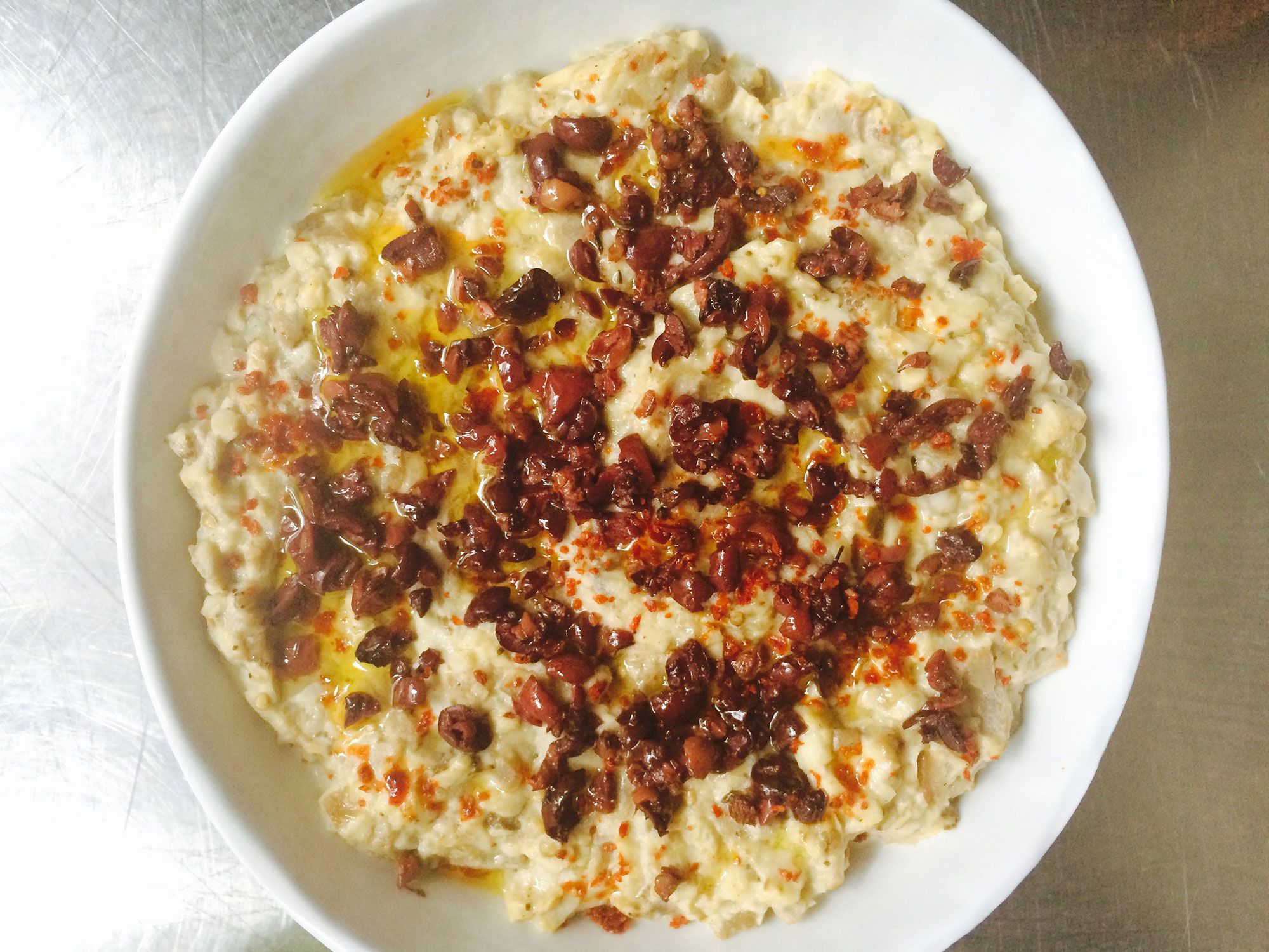 Mayonnaise ensures a creamy, smooth texture in this Midwestern riff on the classic Mediterranean dip by cookbook author Amy Thielen. Chopped cumin seeds add spice and a little crunch to the smoky eggplant. Get the recipe for <a href="http://www.saveur.com/smoky-baba-ghannouj-oil-cured-black-olives-recipe">Smoky Baba Ghannouj with Oil-Cured Black Olives</a>