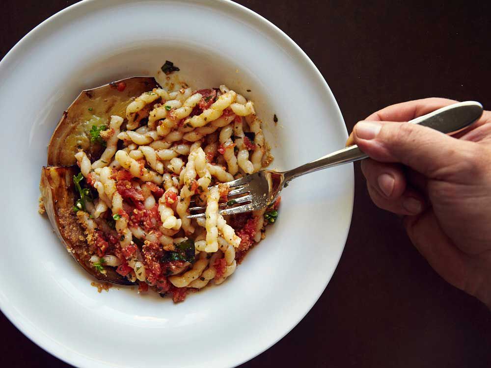 The North African tradition of serving almonds in savory dishes is reflected in the pesto for this dish, in which the nuts are mixed with tomatoes and basil and tossed with <em>busiate</em>, the traditional corkscrew-shaped pasta from Trapani. Though we call for homemade pasta, you can substitute 12 ounces of dried <em>busiate</em>, or your favorite noodle. Get the recipe for <a href="http://www.saveur.com/sicilian-almond-pesto-eggplant-pasta-recipe">Corkscrew Pasta with Eggplant and Tomato-Basil Pesto (Busiate con Pesto alla Trapanese)</a>