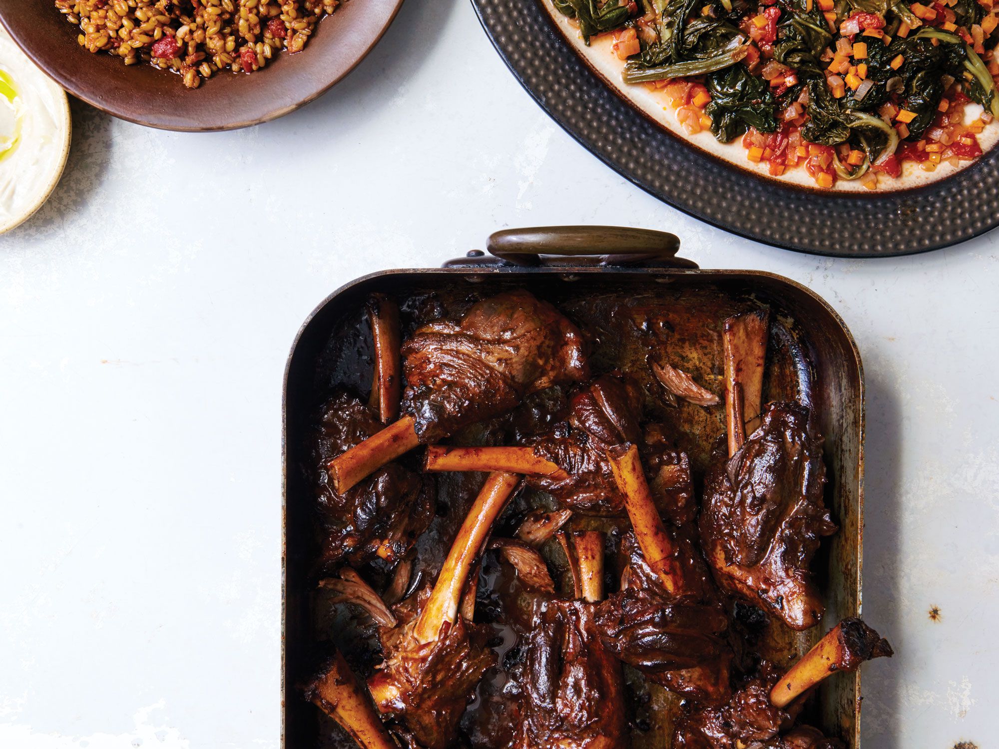 A creamy eggplant purée, enriched with béchamel and Gruyère cheese serves as a bed for meltingly tender lamb shanks, slow-braised in red wine and aromatics. Get the recipe for <a href="http://www.saveur.com/braised-lamb-shanks-with-eggplant-recipe">Lamb Shanks in Red Wine with Creamy Eggplant</a>