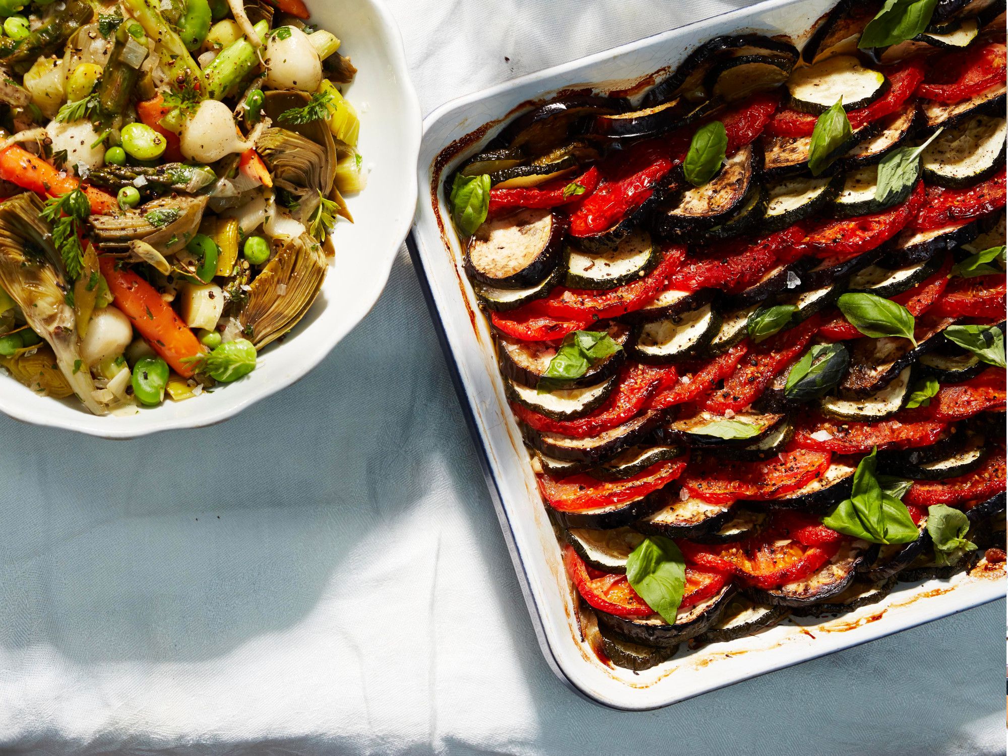 A tian is a type of gratin, typically vegetables baked in an earthenware dish. (The word "tian" also refers to the earthenware dish itself.) This classic Provençal version is made with alternating rows of sliced zucchini, eggplant, and tomato. The flavors meld as the vegetables cook together, somewhat like ratatouille. Seasoned simply with thyme, garlic, and good fruity olive oil, the dish is best served at room temperature. Lulu insists it tastes even better made a day in advance. Get the recipe for <a href="http://www.saveur.com/provencal-vegetable-gratin-tian-recipe">Provençal Vegetable Tian</a>