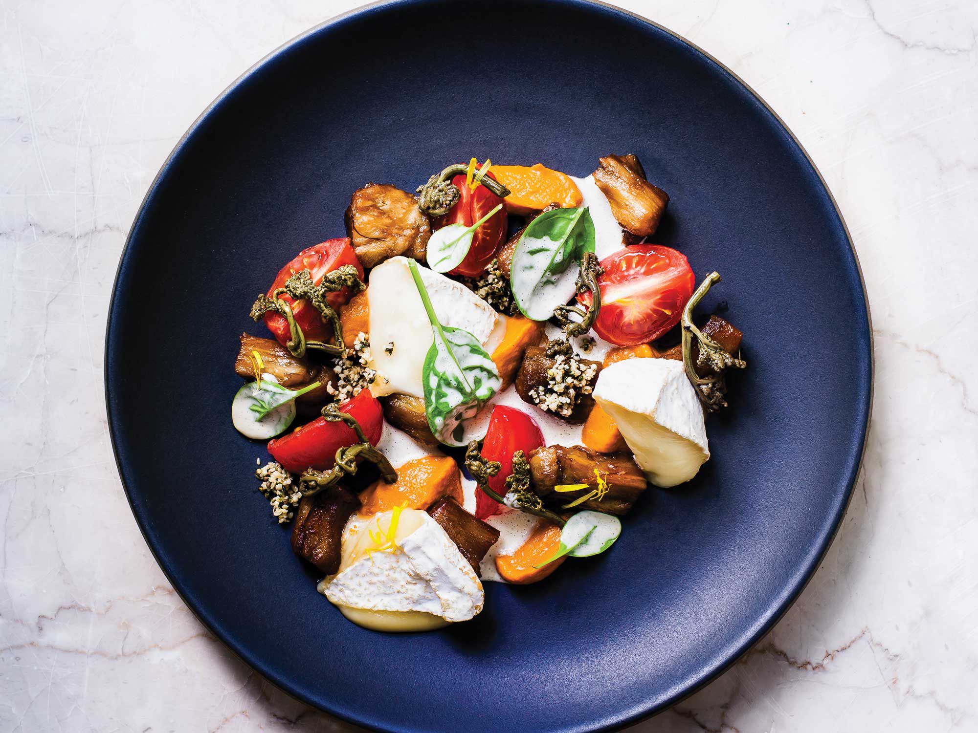 For this comforting roasted eggplant salad, Sergey and Ivan glaze the eggplant with kvass, a traditional Slavic drink made from fermented rye bread. Get the recipe for <a href="https://www.saveur.com/eggplant-salad-hemp-seed-sauce-recipe/">Warm Eggplant Salad with Hemp Seed Sauce</a>