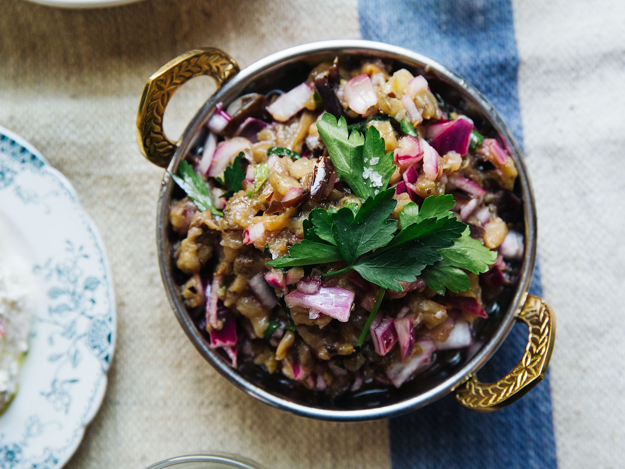 Charcoal-grilled eggplants are a common Greek meze dish. Get the recipe for <a href="https://www.saveur.com/melitzanosalata-greek-eggplant-spread-recipe/">Greek Grilled Eggplant Spread (Melitzanosalata)</a>