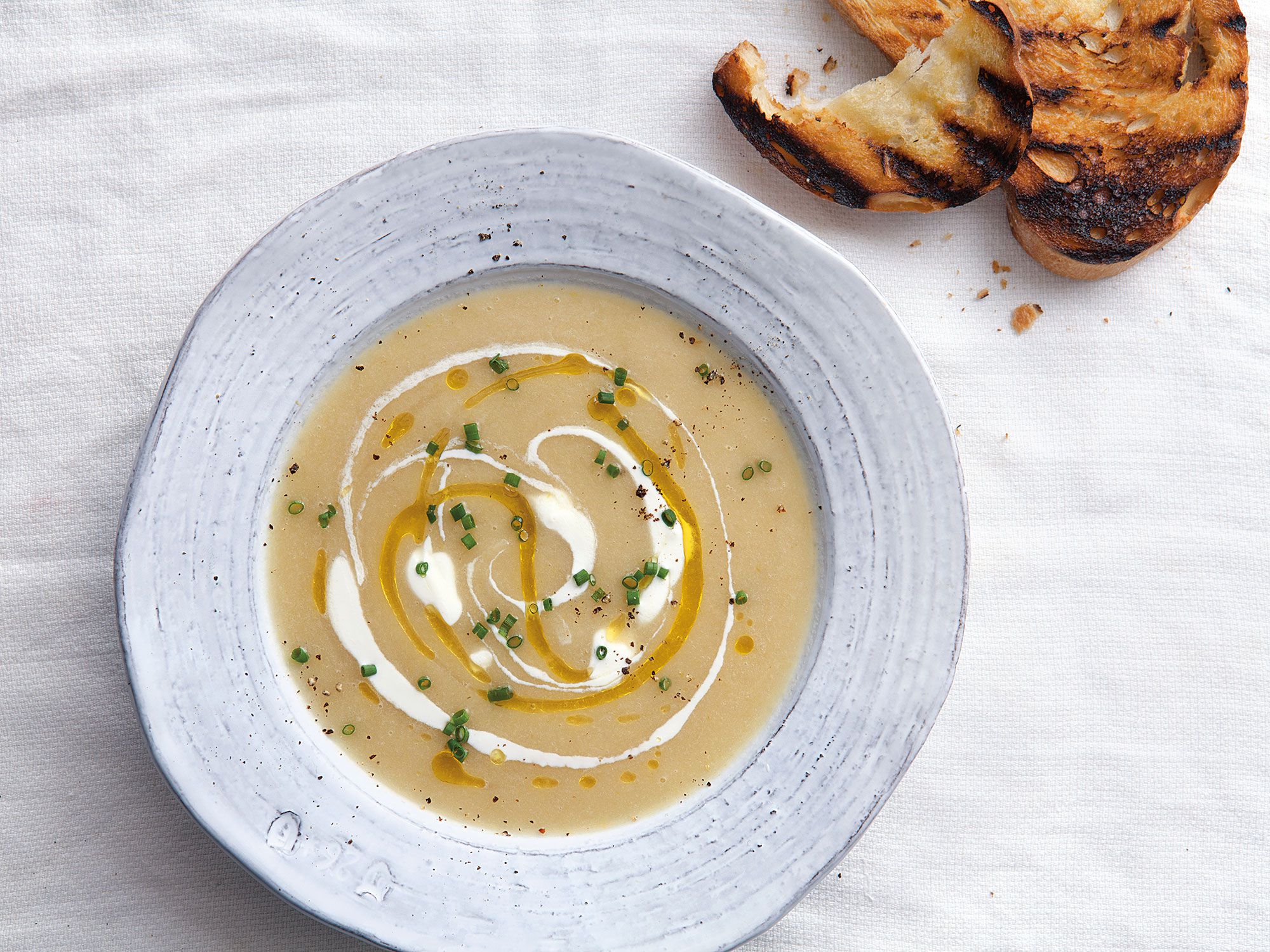 This creamy, rich soup is a favorite in Mexico City. In summer it's usually chilled like a vichyssoise, but it's also served hot, especially in the cooler months. Get the recipe for <a href="https://www.saveur.com/article/Recipes/Mexico-Potato-Leek-Soup">Chilled Mexican Potato and Leek Soup (Sopa de Poro y Papa)</a>