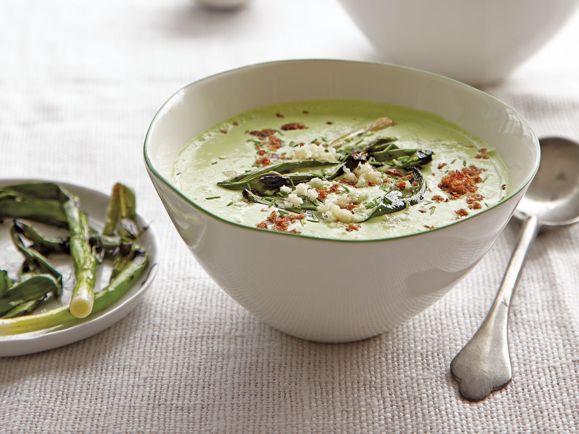 This tangy chilled soup is topped with charred scallions. Get the recipe for <a href="https://www.saveur.com/article/recipes/spinach-chive-and-yogurt-soup-with-grilled-scallions/">Spinach, Chive, and Yogurt Soup with Grilled Scallions </a>