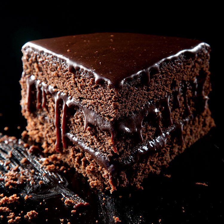 Three velvety layers sandwiched with thick dark chocolate icing make a decadent, crowd-pleasing dessert. Get the recipe for <a href="https://www.saveur.com/article/Recipes/Very-Moist-Chocolate-Layer-Cake/">Very Moist Chocolate Layer Cake</a>