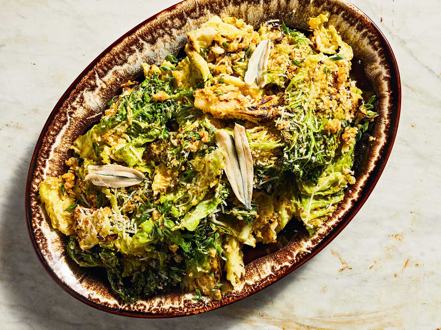 In this summery, modern take on a Caesar salad, flame-kissed savoy cabbage replaces the usual romaine. It’s the perfect foil for garlicky bread crumbs, aged pecorino, boquerones, and a citrusy anchovy vinaigrette. Get the recipe for <a href="https://www.saveur.com/grilled-cabbage-caesar-salad-recipe/">Grilled-Cabbage Caesar Salad</a>