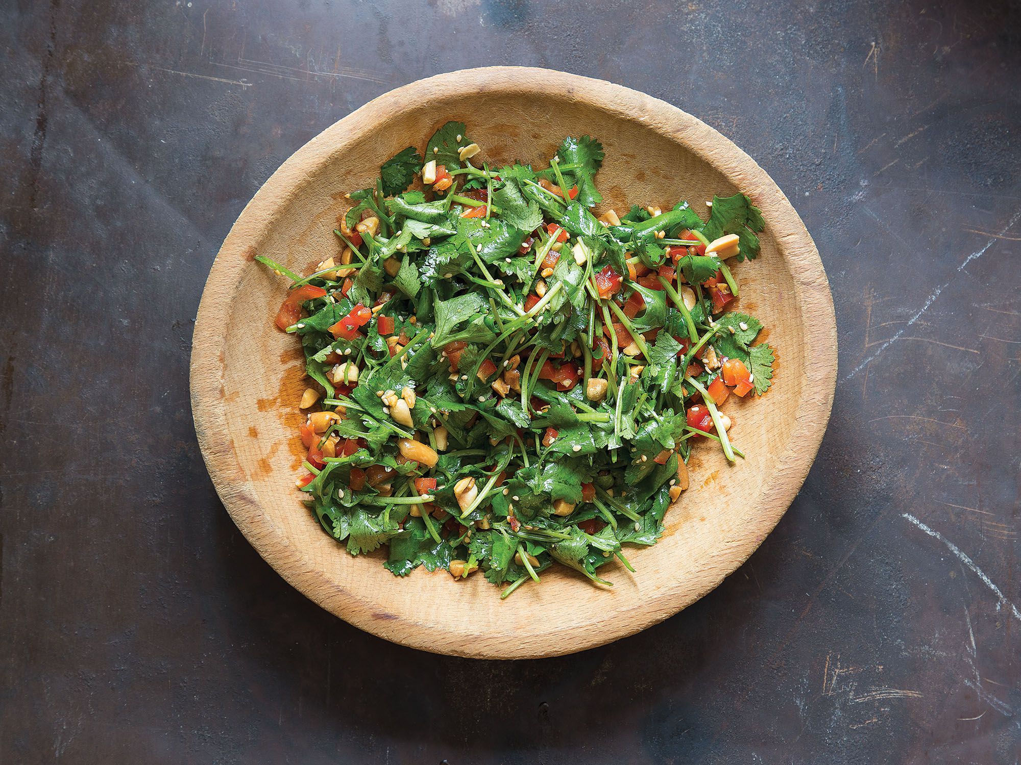 This refreshing salad is a perfect to accompaniment to fatty grilled meats. Use the most delicate cilantro you can find, so the stems can be eaten along with the leaves. Get the recipe for <a href="https://www.saveur.com/chinese-cilantro-peanut-salad-recipe/">Cilantro and Peanut Salad (Huāshēngmĭ bàn xiāngcài)</a>