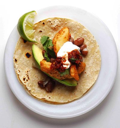 Charred tomatoes and chiles add a deep smoky note to the salsa for these fresh fish tacos—either flounder or halibut works well. Get the recipe for <a href="https://www.saveur.com/article/Recipes/Saveur-100-2011-Fish-Tacos-with-Roasted-Tomato-Salsa/">
Fish Tacos with Roasted Tomato Salsa</a>