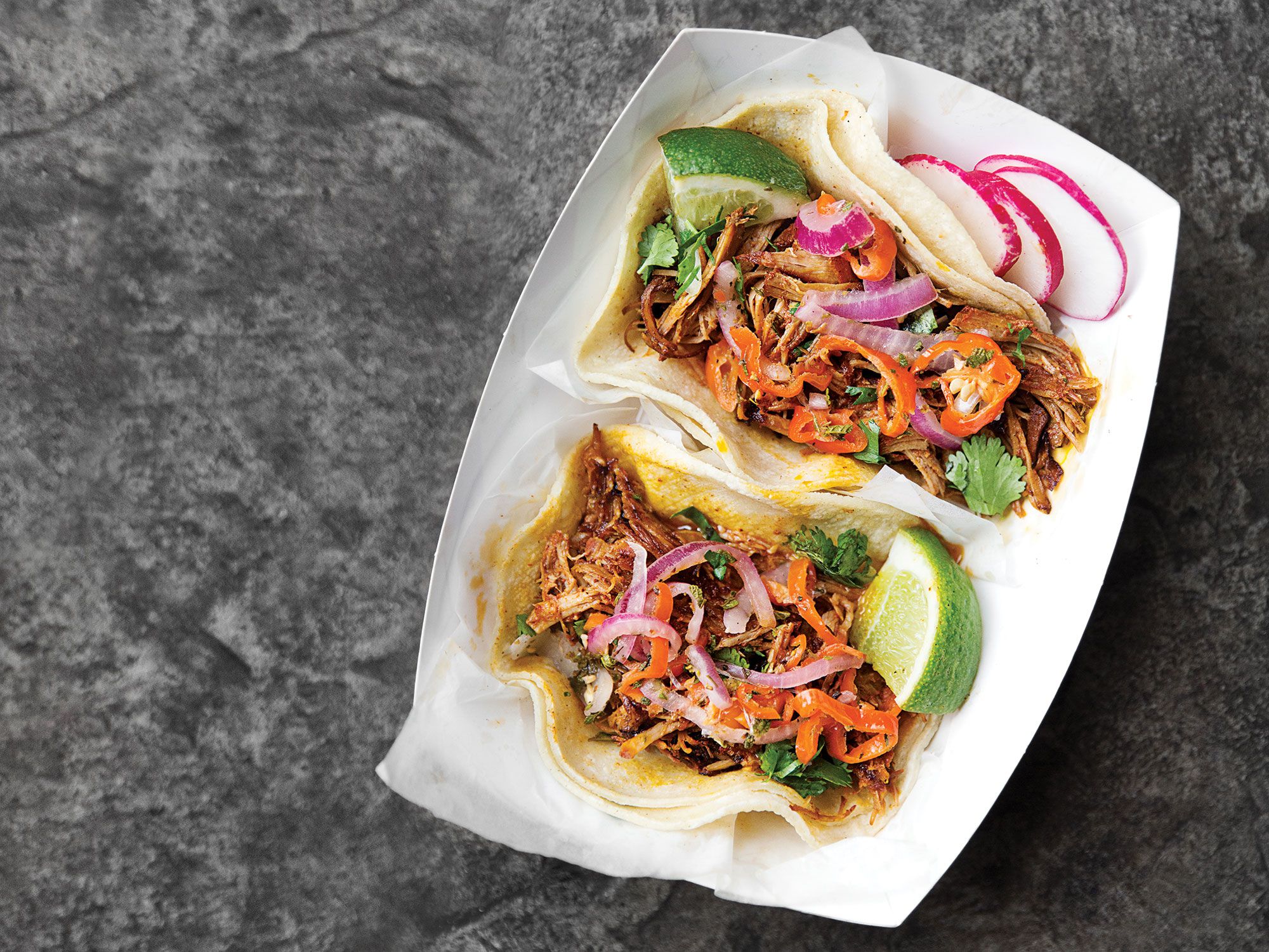 This pibil recipe, inspired by one used at Chando's in Sacramento and prepared in a Dutch oven, pops with earthy achiote paste and citrus juices, yielding a luscious, spicy pulled pork. Get the recipe for <a href="https://www.saveur.com/article/recipes/achiote-pulled-pork-tacos/">Yucatán-Style Shredded Pork Tacos with Achiote (Cochinita Pibil Tacos)</a>