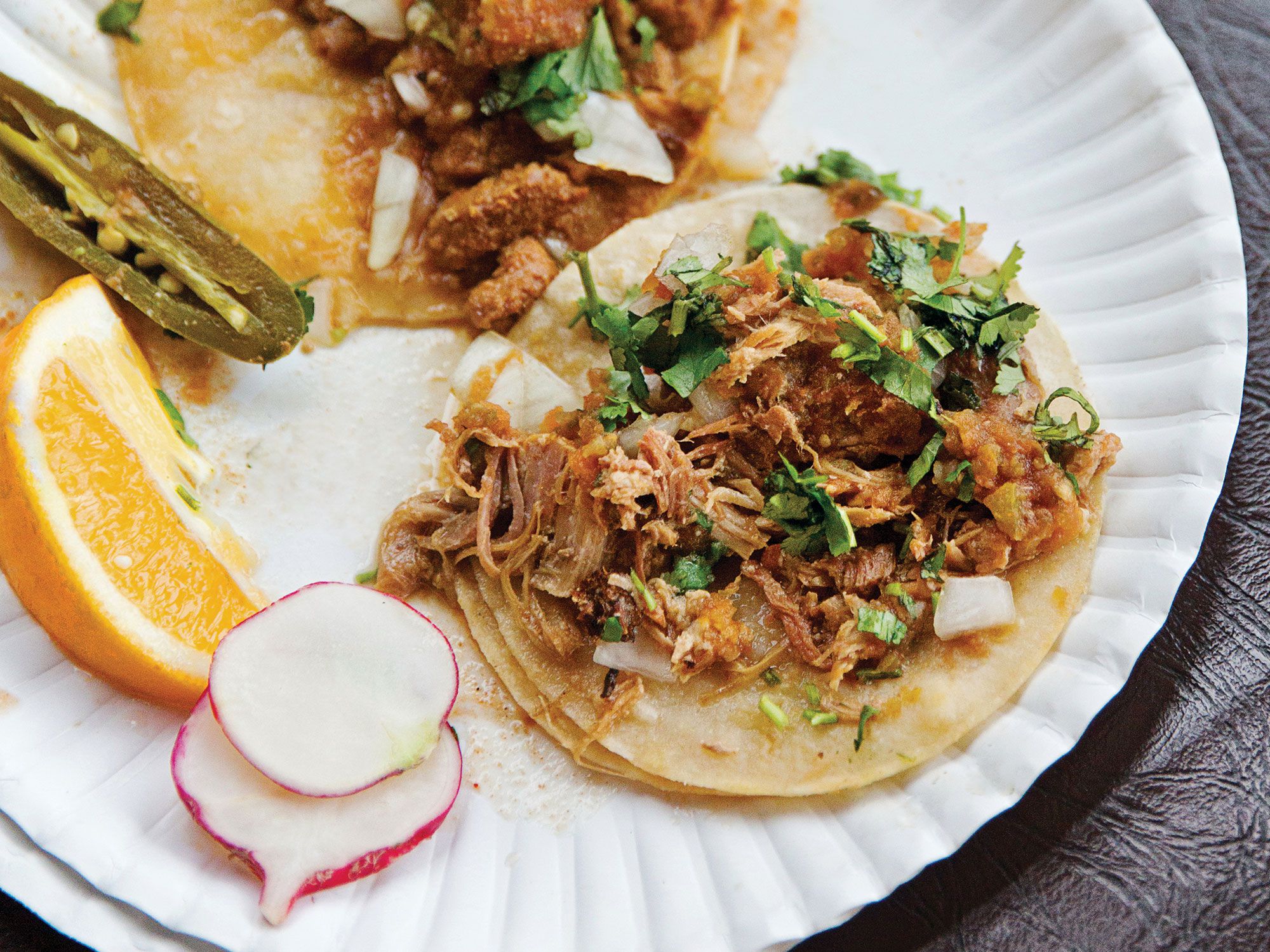 At the Viva Taco bus in Turlock, Silvestre Valencia adds jalapeño pickling liquid to the pork braise, which tenderizes the meat and keeps it from drying out. Get the recipe for <a href="http://www.saveur.com/article/recipes/carnitas-pork-tacos">Carnitas Tacos</a>