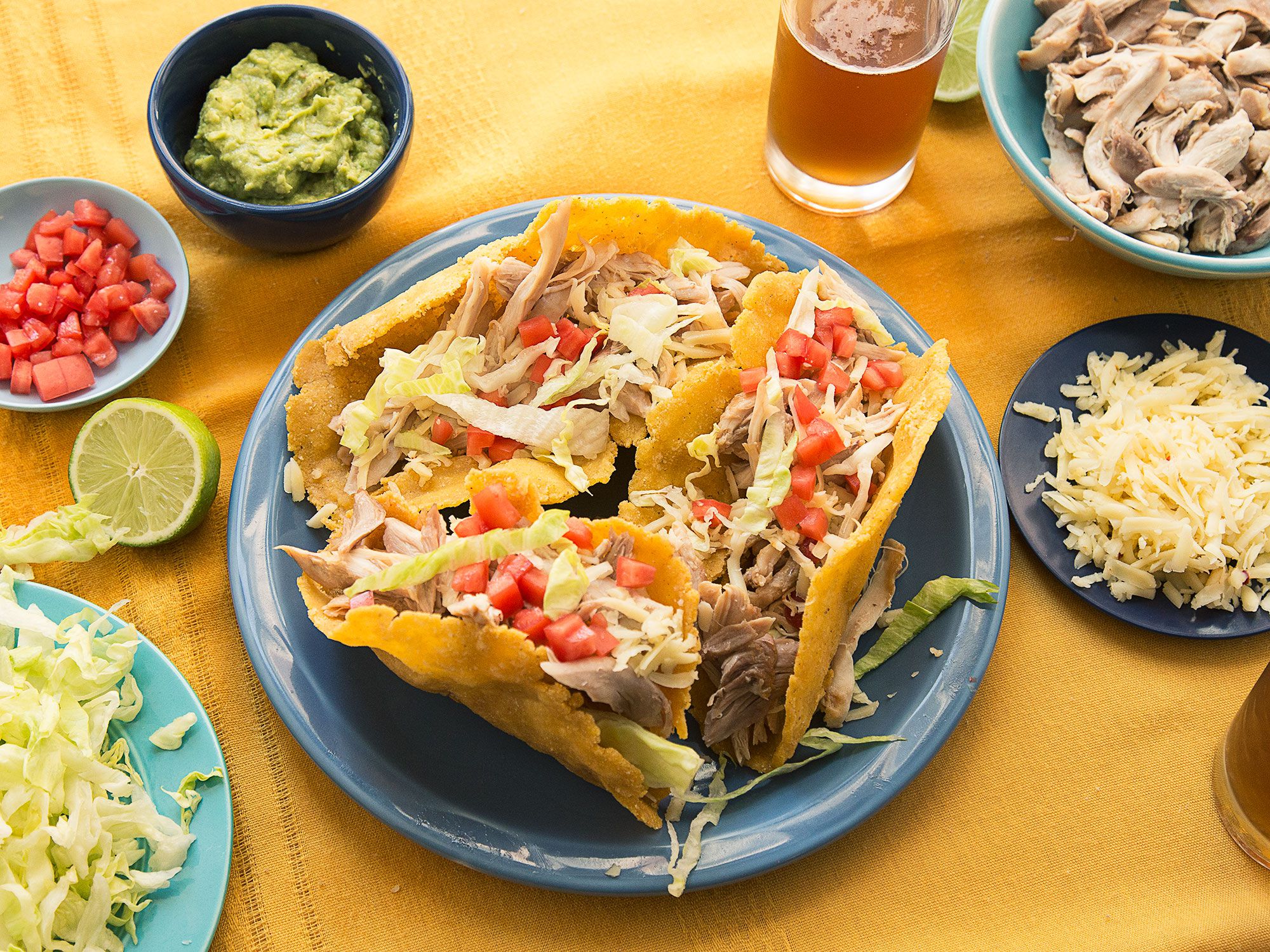 This recipe for puffy tacos filled with spicy chicken and guacamole comes from Rolando's Super Tacos in San Antonio. Get the recipe for <a href="https://www.saveur.com/article/Recipes/puffy-chicken-tacos/">Puffy Chicken Tacos</a>